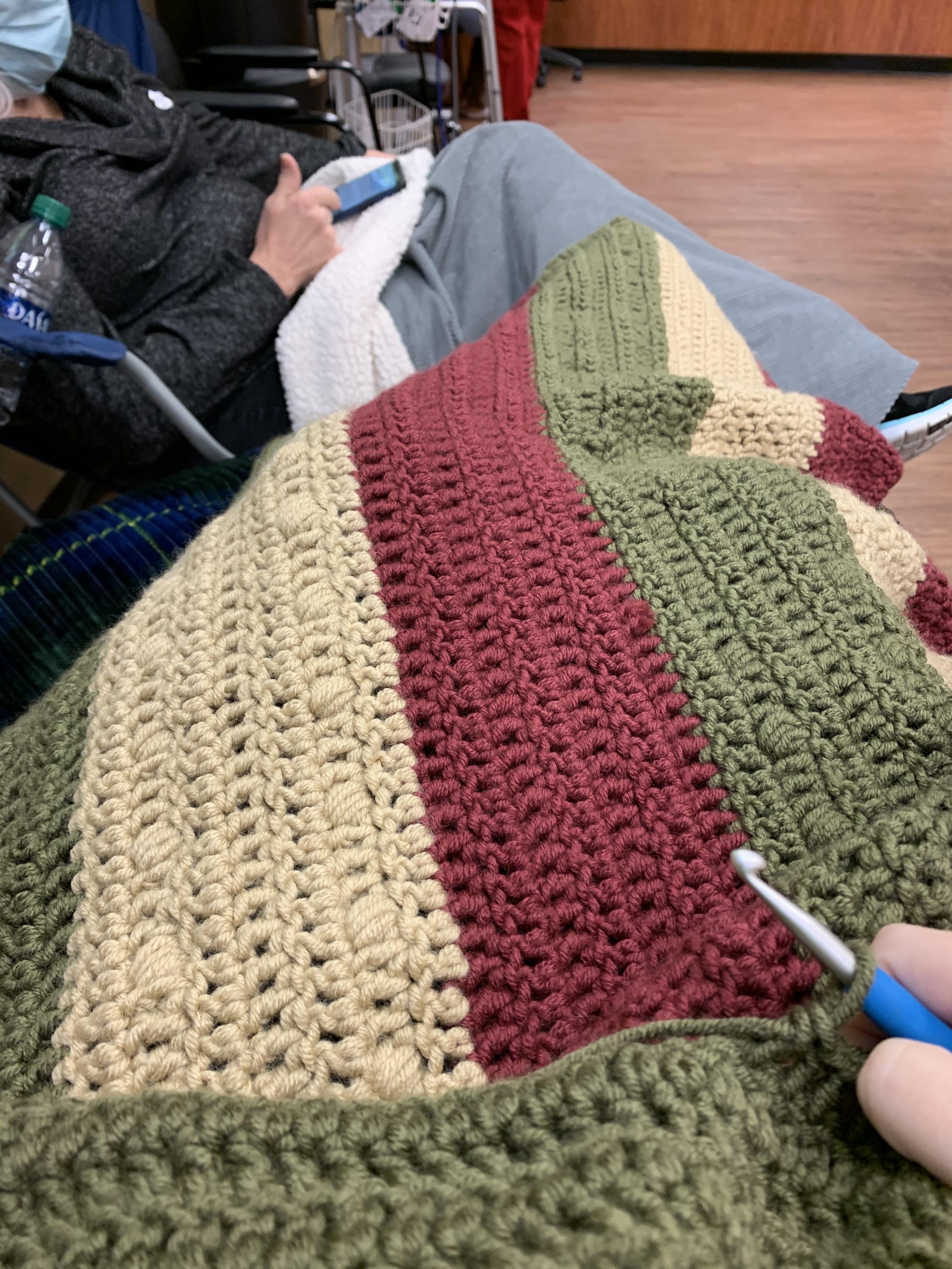 Creating a blanket and killing my cancer at the same time. Nine hours of chemo gives you a lot