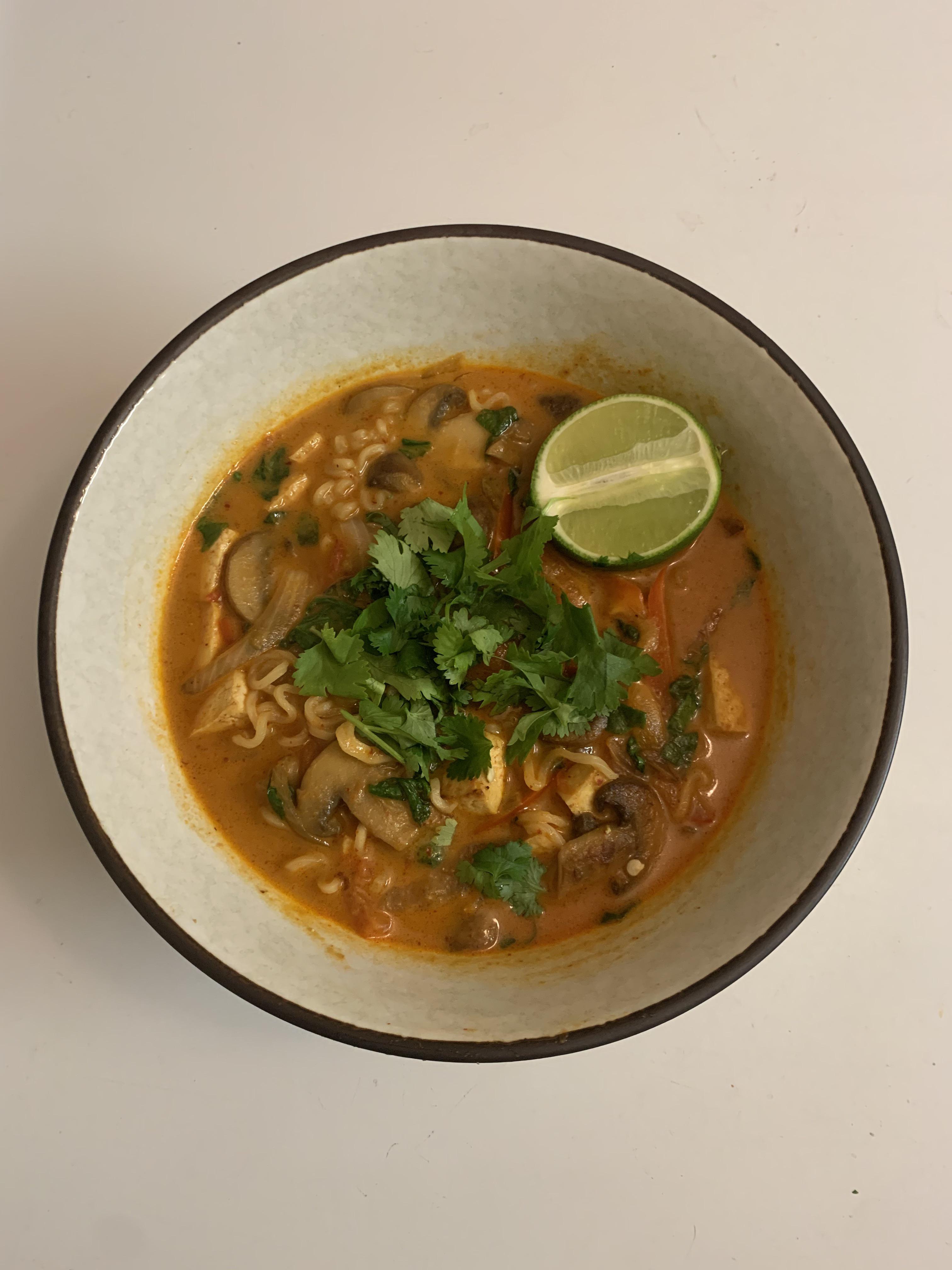Tom Kha ramen using Maruchan Soy sauce flavor. Added in Tom yum paste, coconut milk, tofu