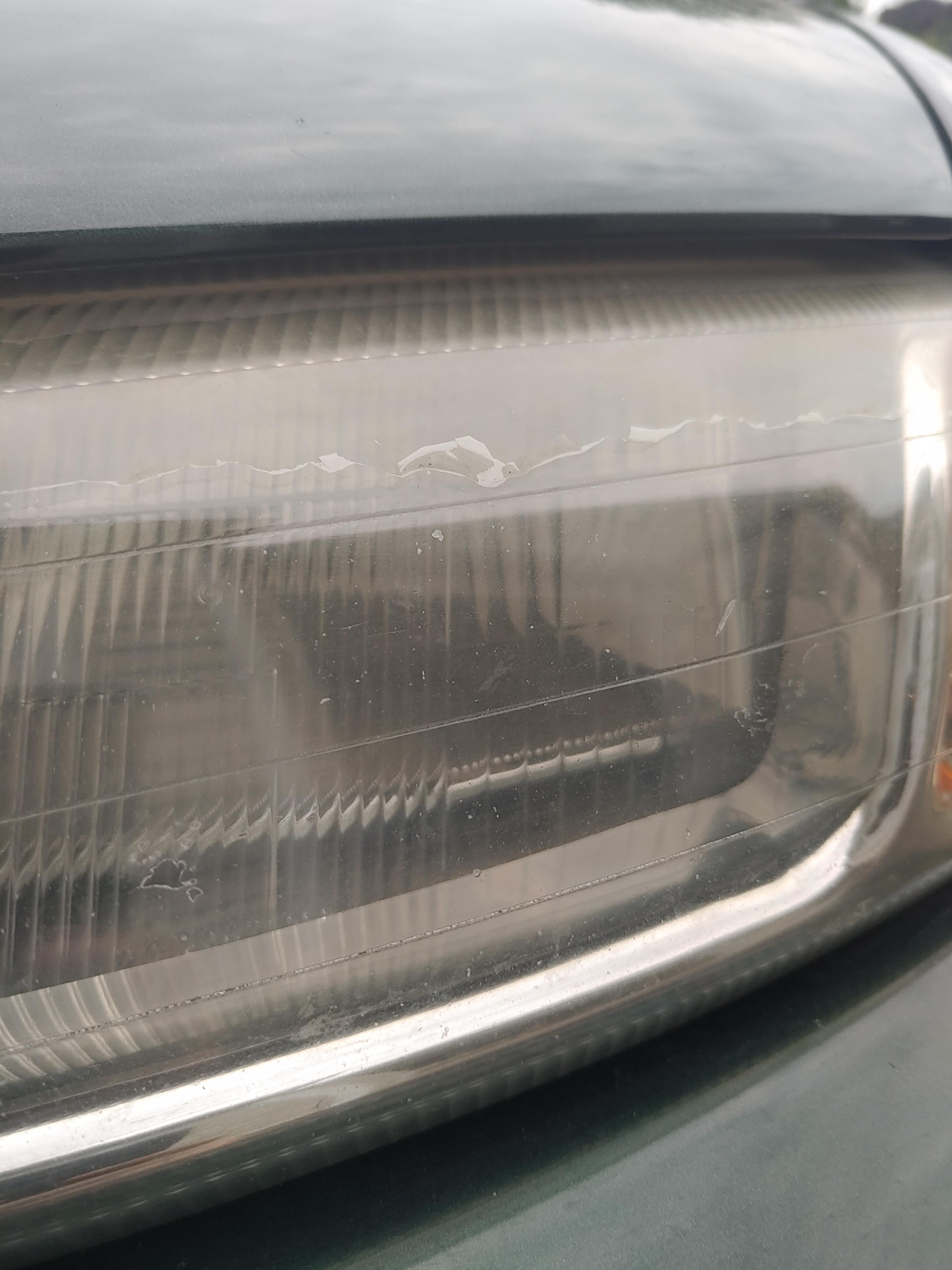 Headlight film peeling. What is the cause/solution to this? 1999