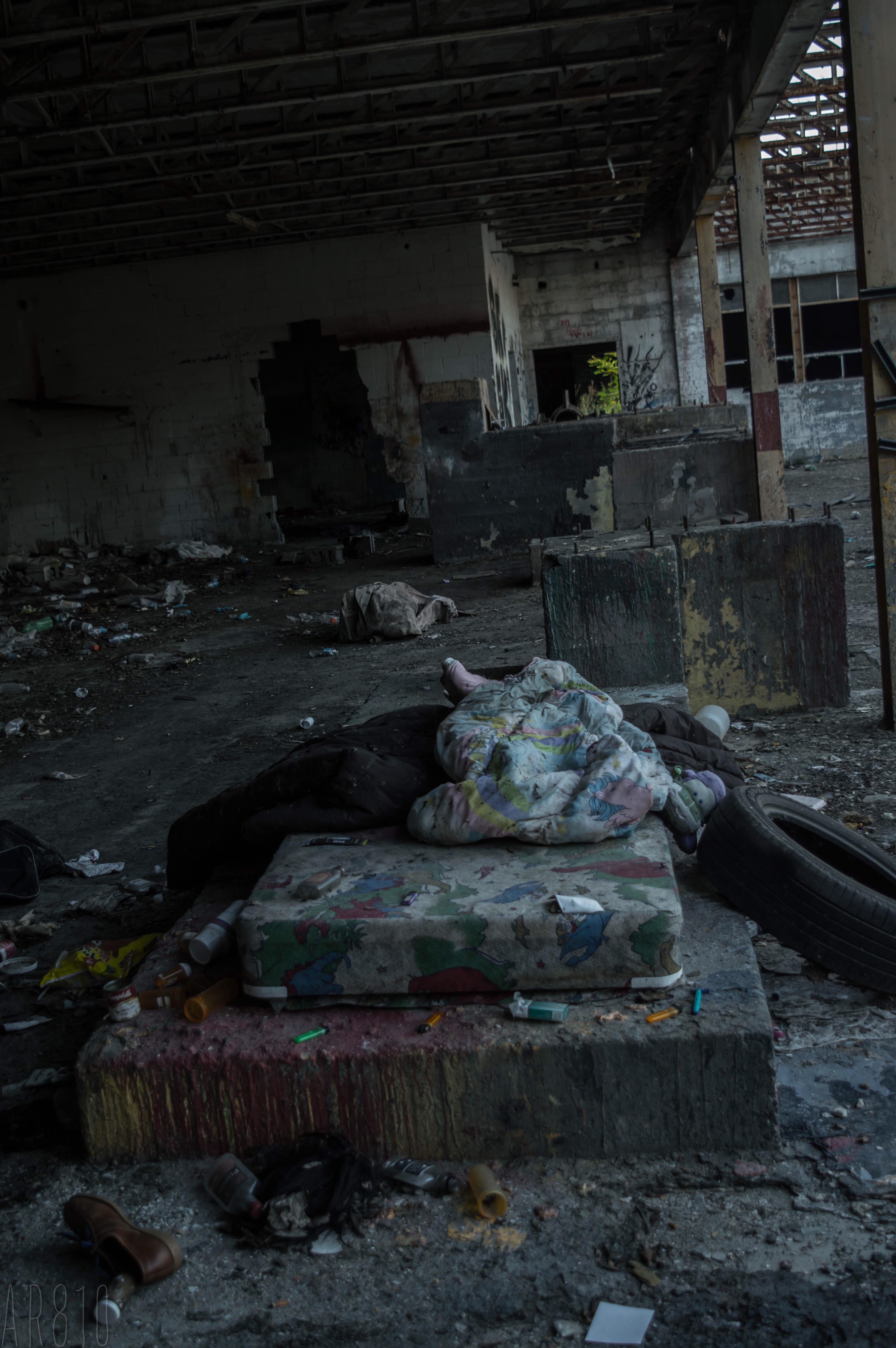 Bed in a vacant warehouse. Flint, Mi. [4000x6016] [OC] r/AbandonedPorn