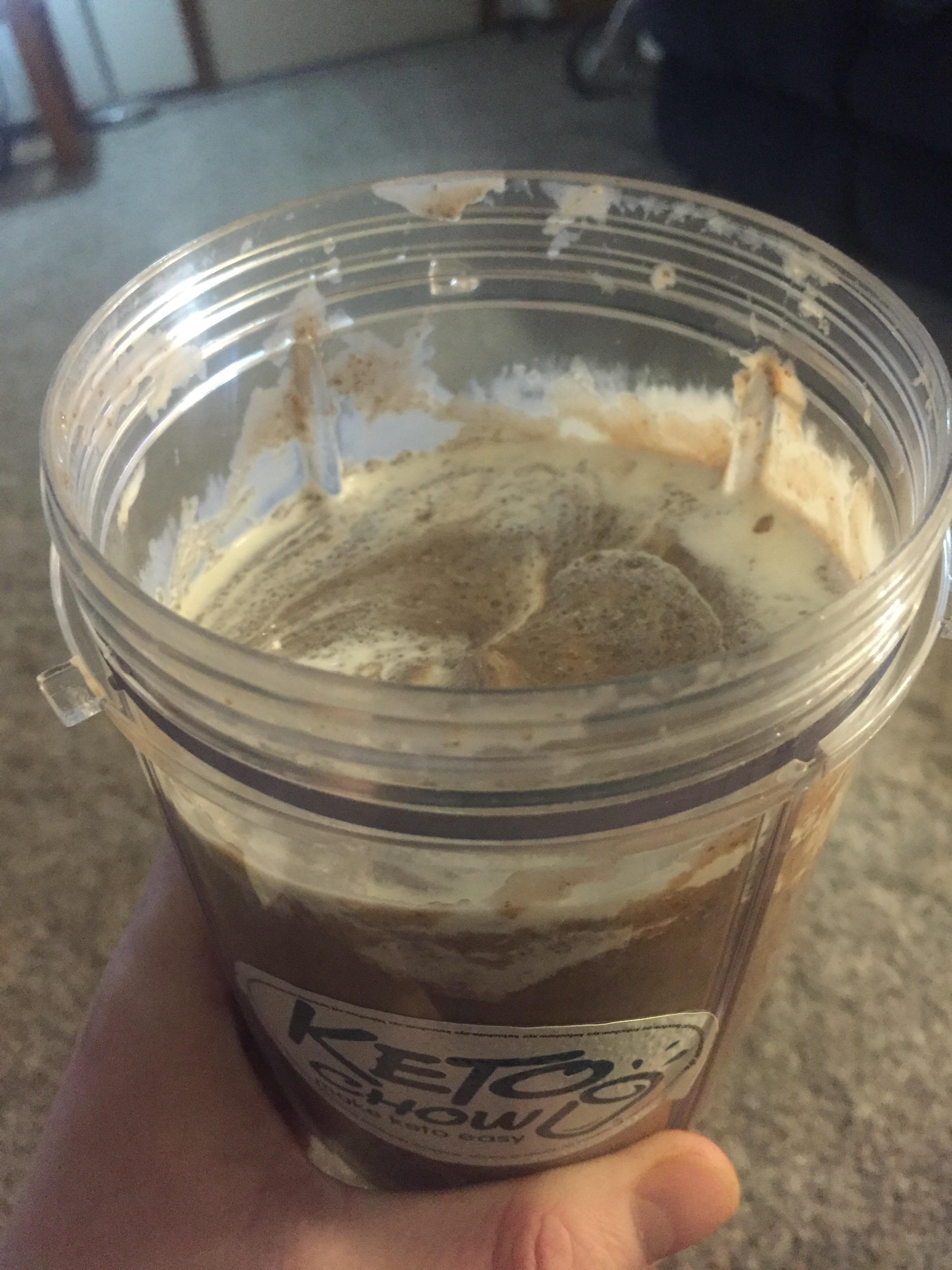 This chocolate avocado chia keto chow shake with heavy cream drizzled