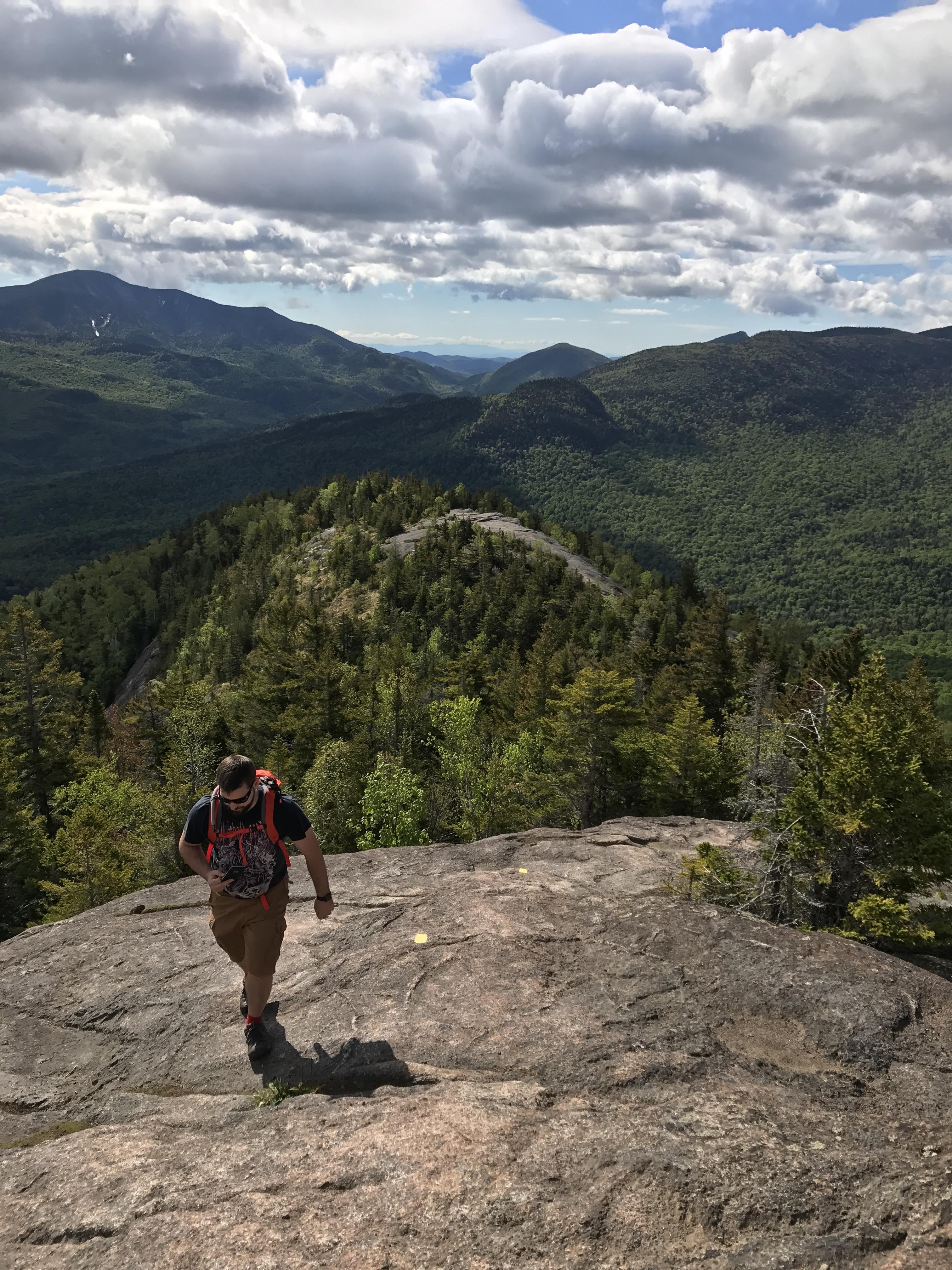 Looking back at the Brothers peaks hiking to Big Slide Mountain