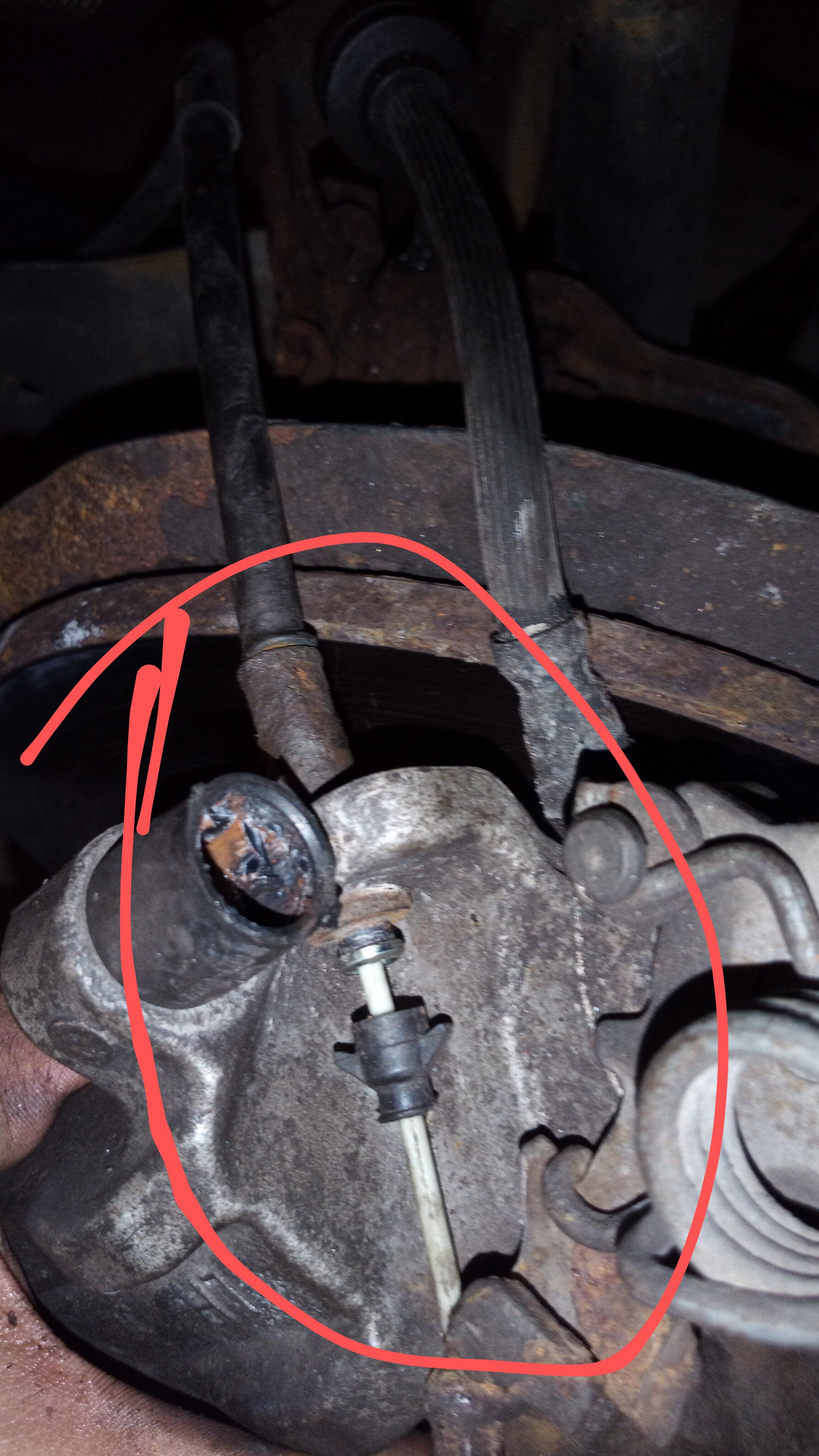 how do I get this e brake cable off my caliper? r/MechanicAdvice
