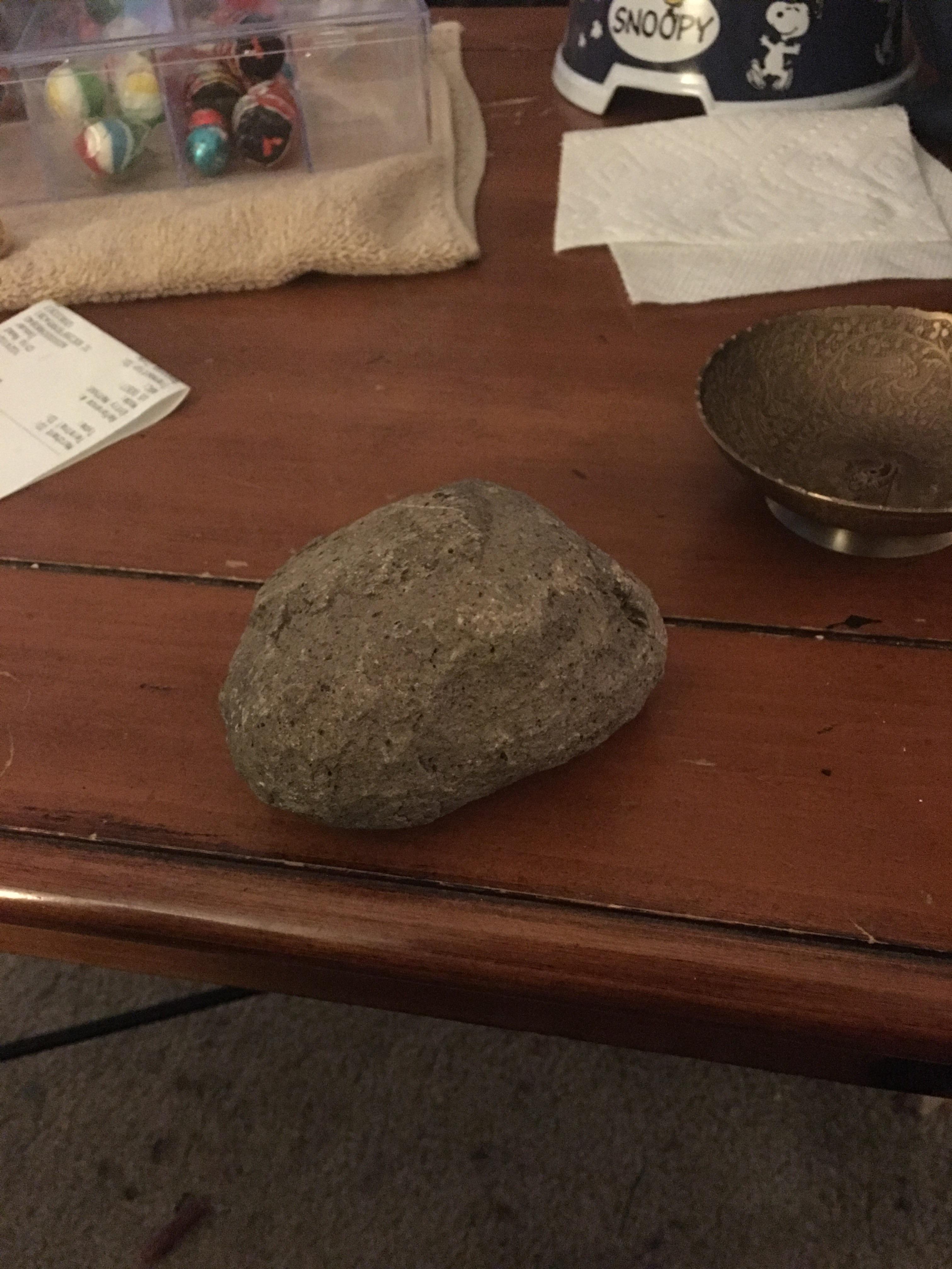 Possible meteorite, this rock weighs 1.8 pounds with a density of 40g