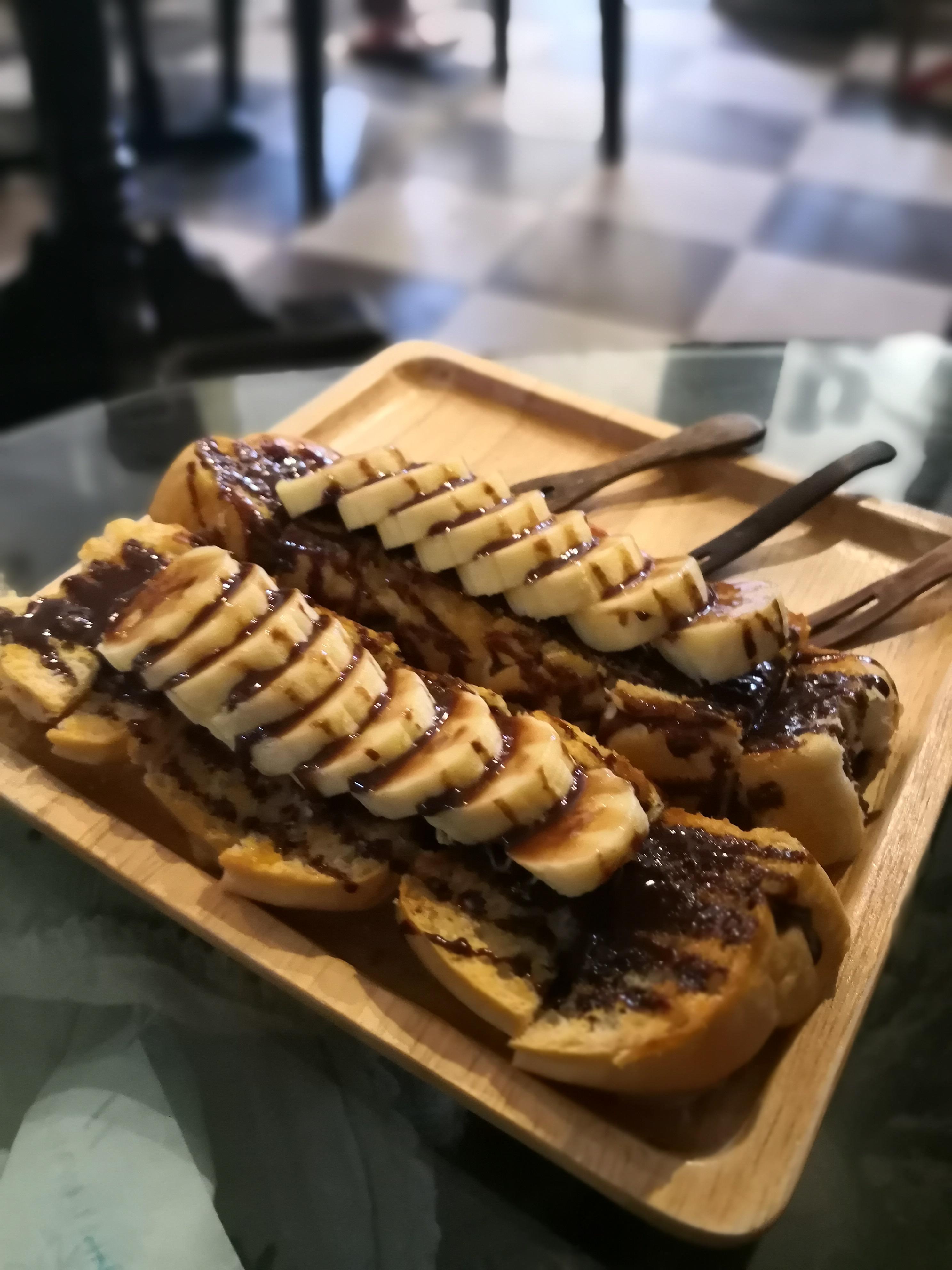 [I ate] banana drizzled with chocolate sauce on warm banana and