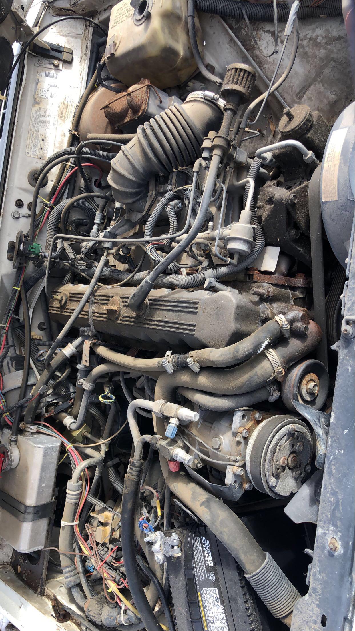 What seems to be missing from the engine bay of this 1995 jeep cherokee