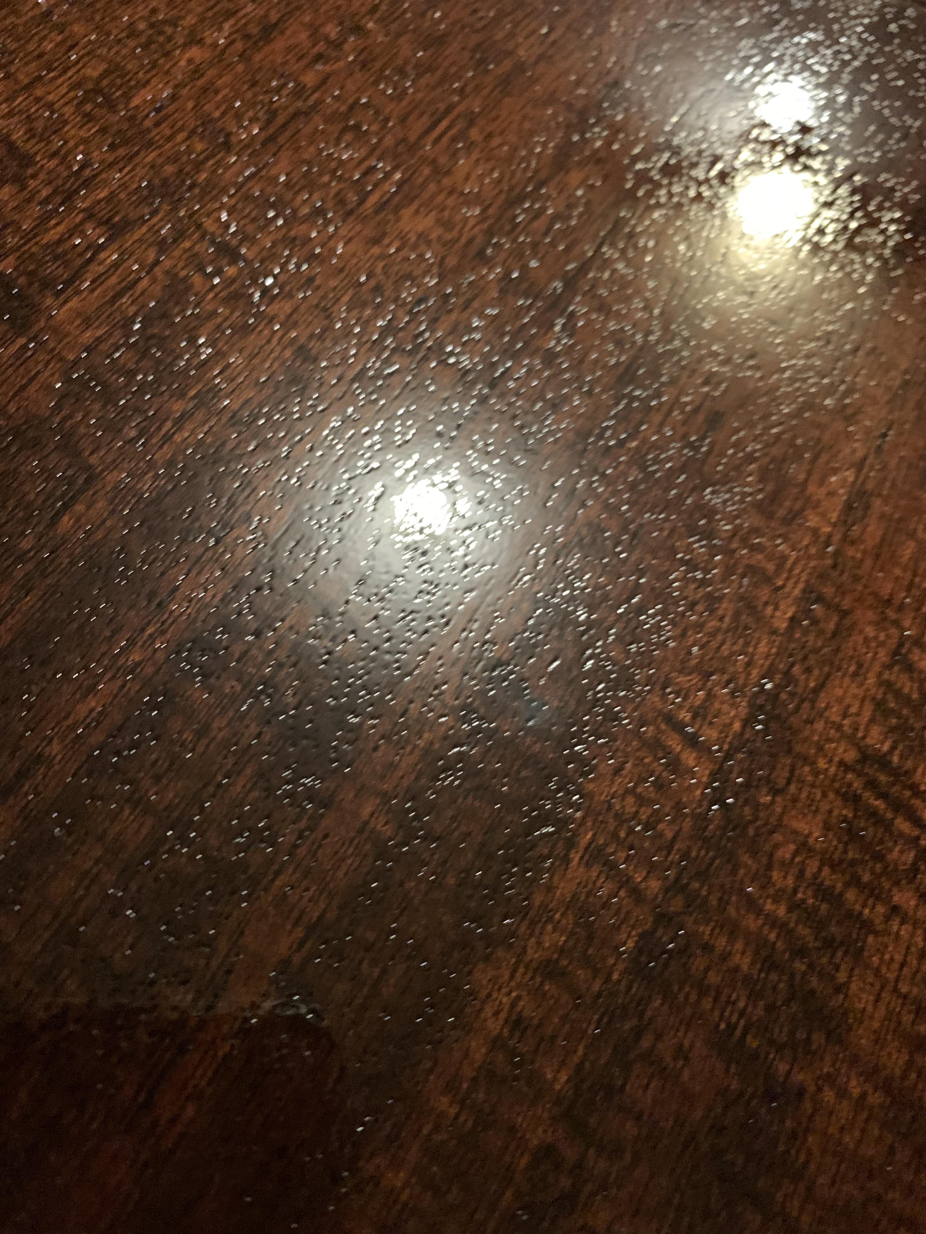 Small “divots” after applying polyurethane then shellac and now