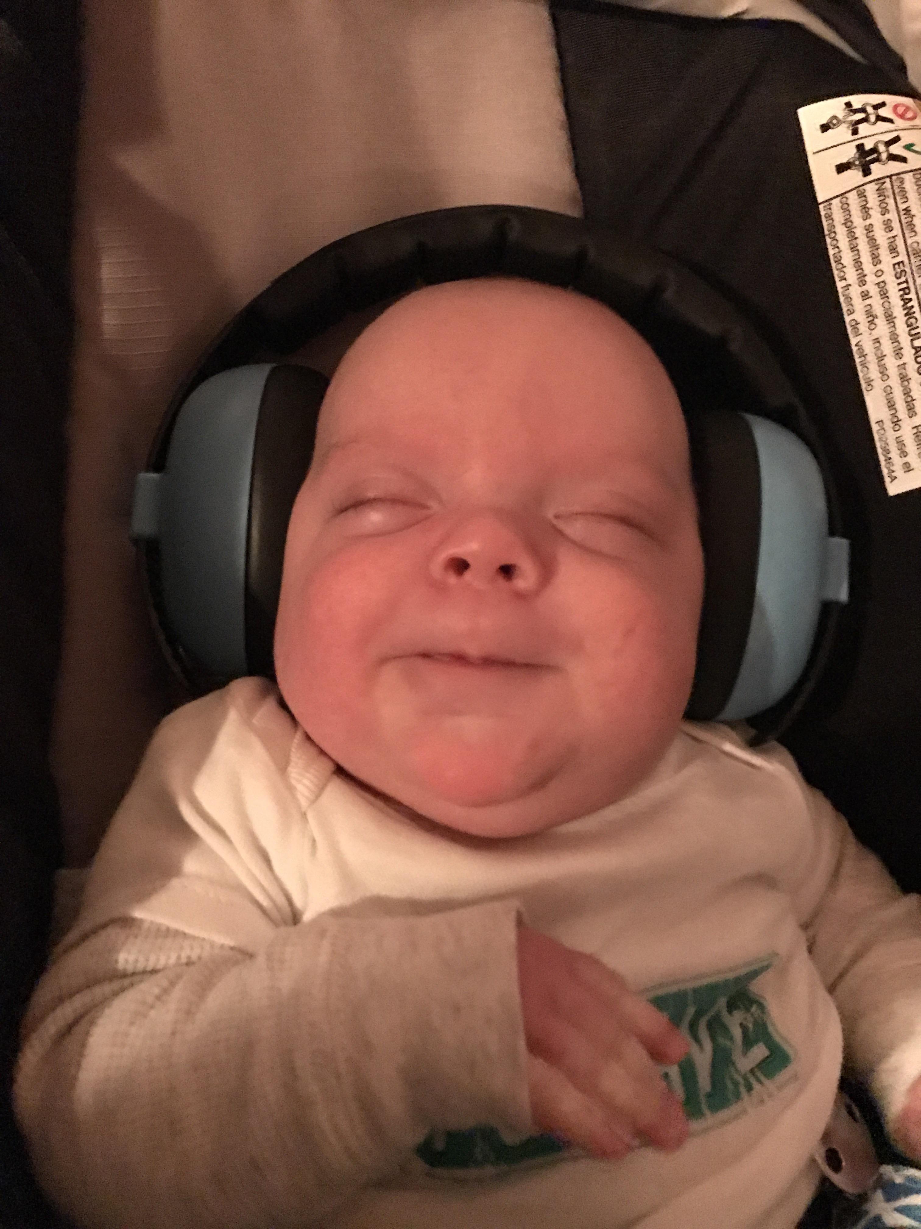 My son, at my gig wearing ear protection. Happy guy. r/aww