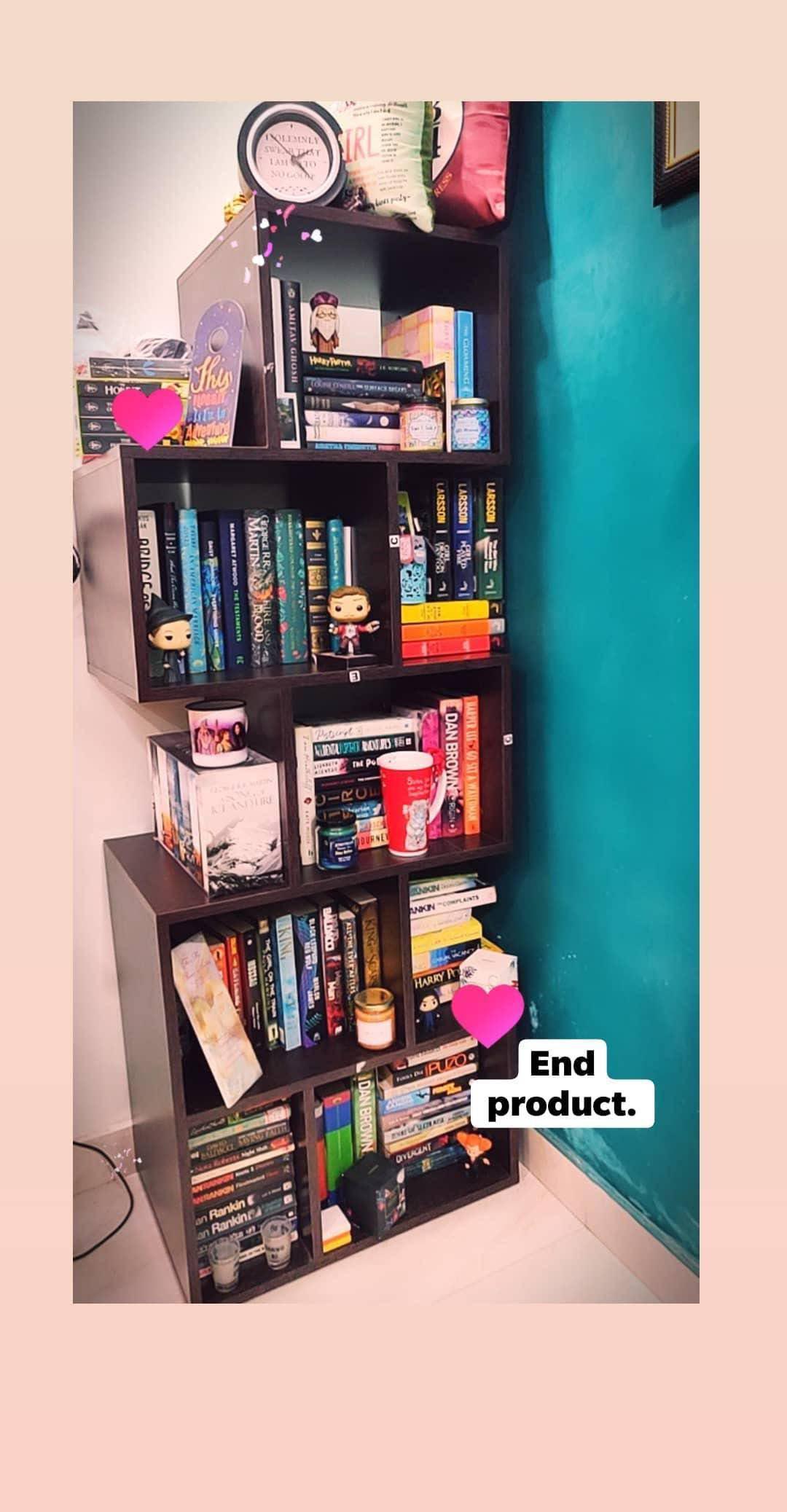 Symmetrical. Big fan of tucking knick knacks around.