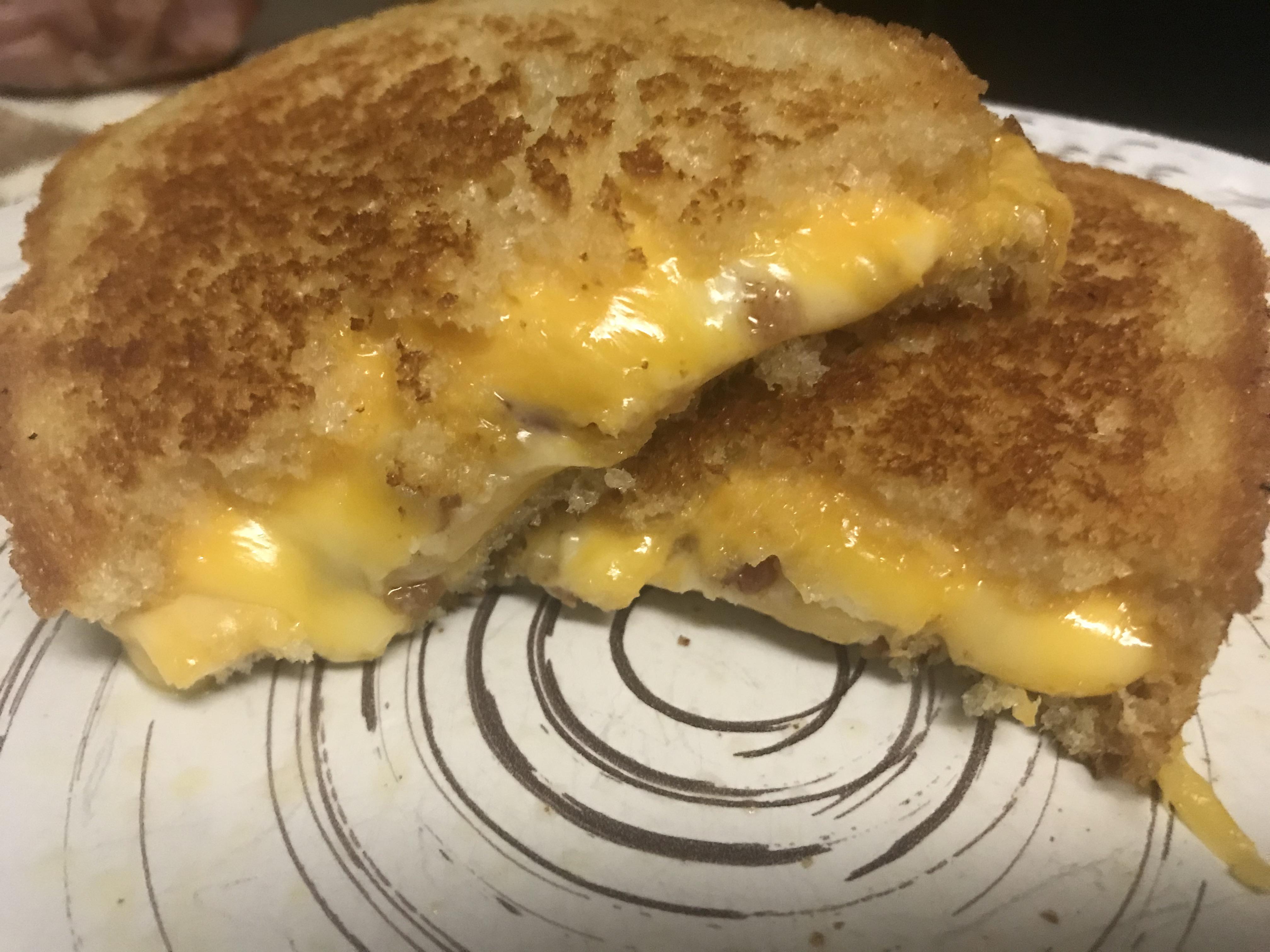 Cheddar, Gouda, and shredded italian blend on sourdough. Breads is