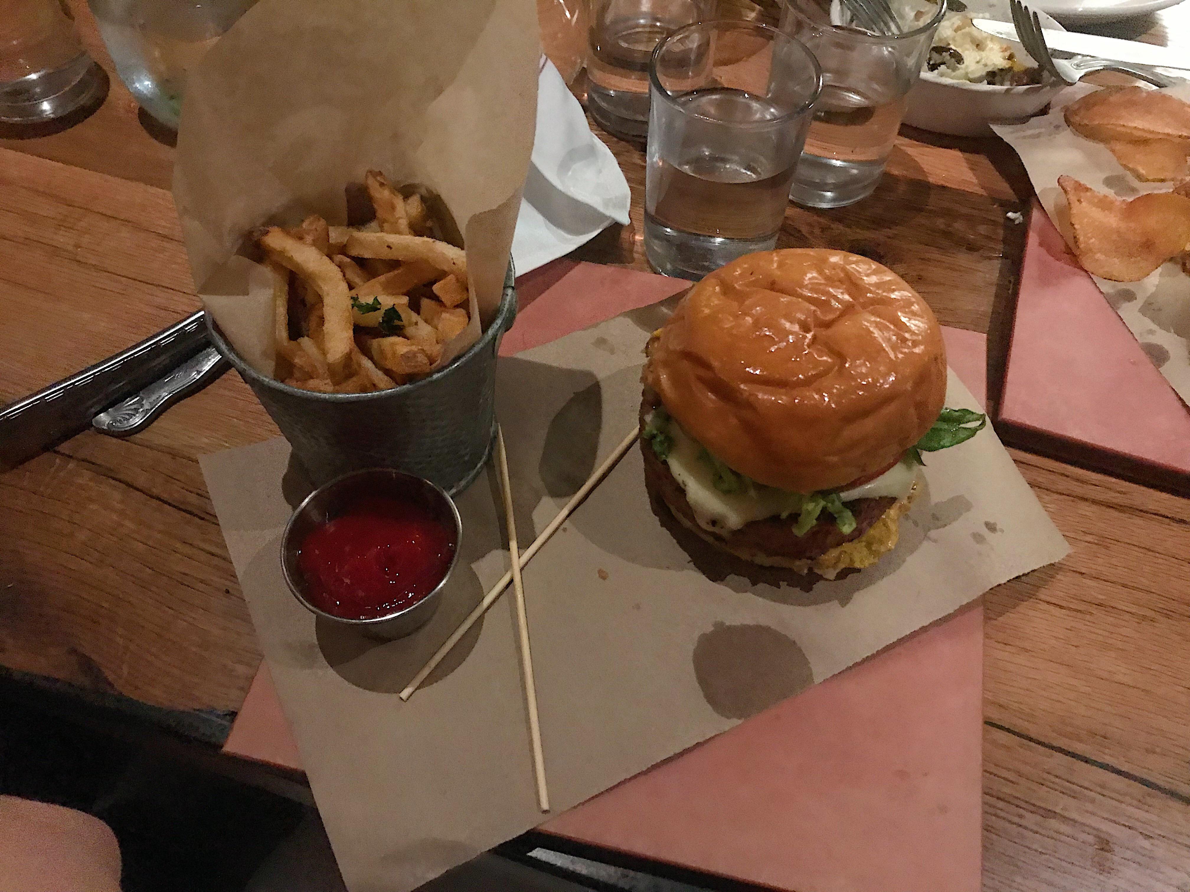 A greasy burger served on a heavy tile. It got so messy r/WeWantPlates