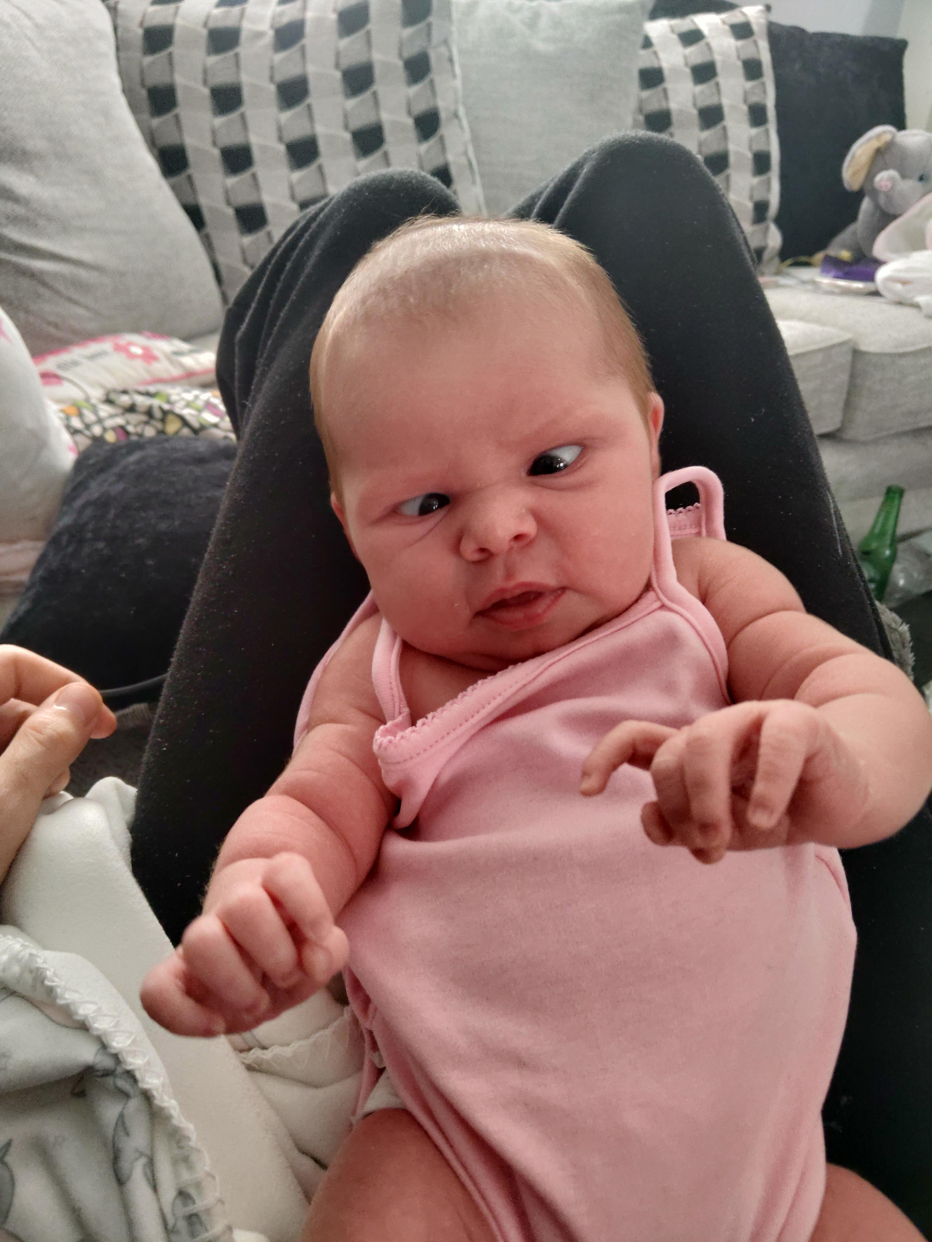 Caught possibly the best photo of my 2 week old daughter. r/daddit