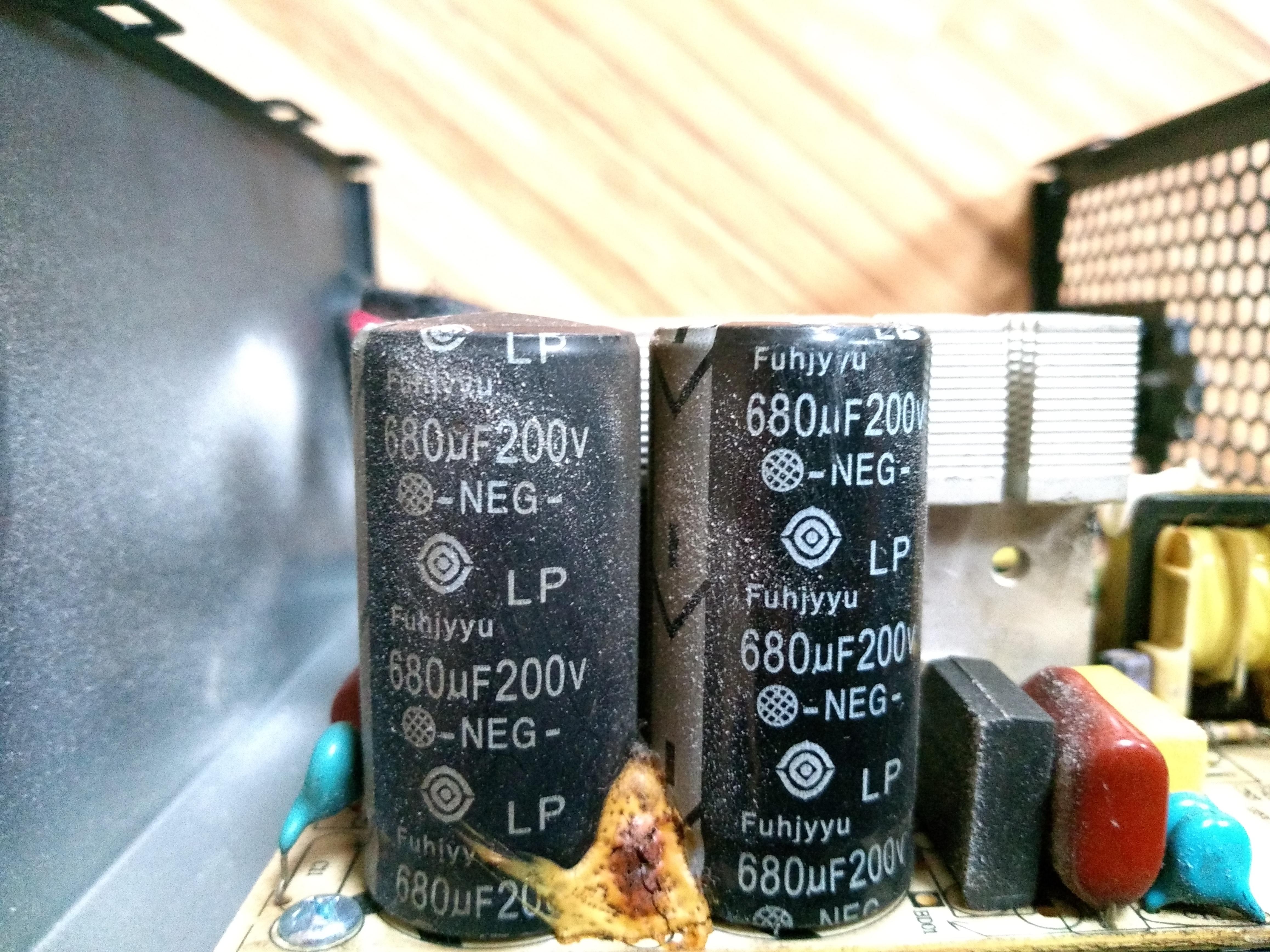 Is this Capacitor destroyed? The left one has a slight bulge on top