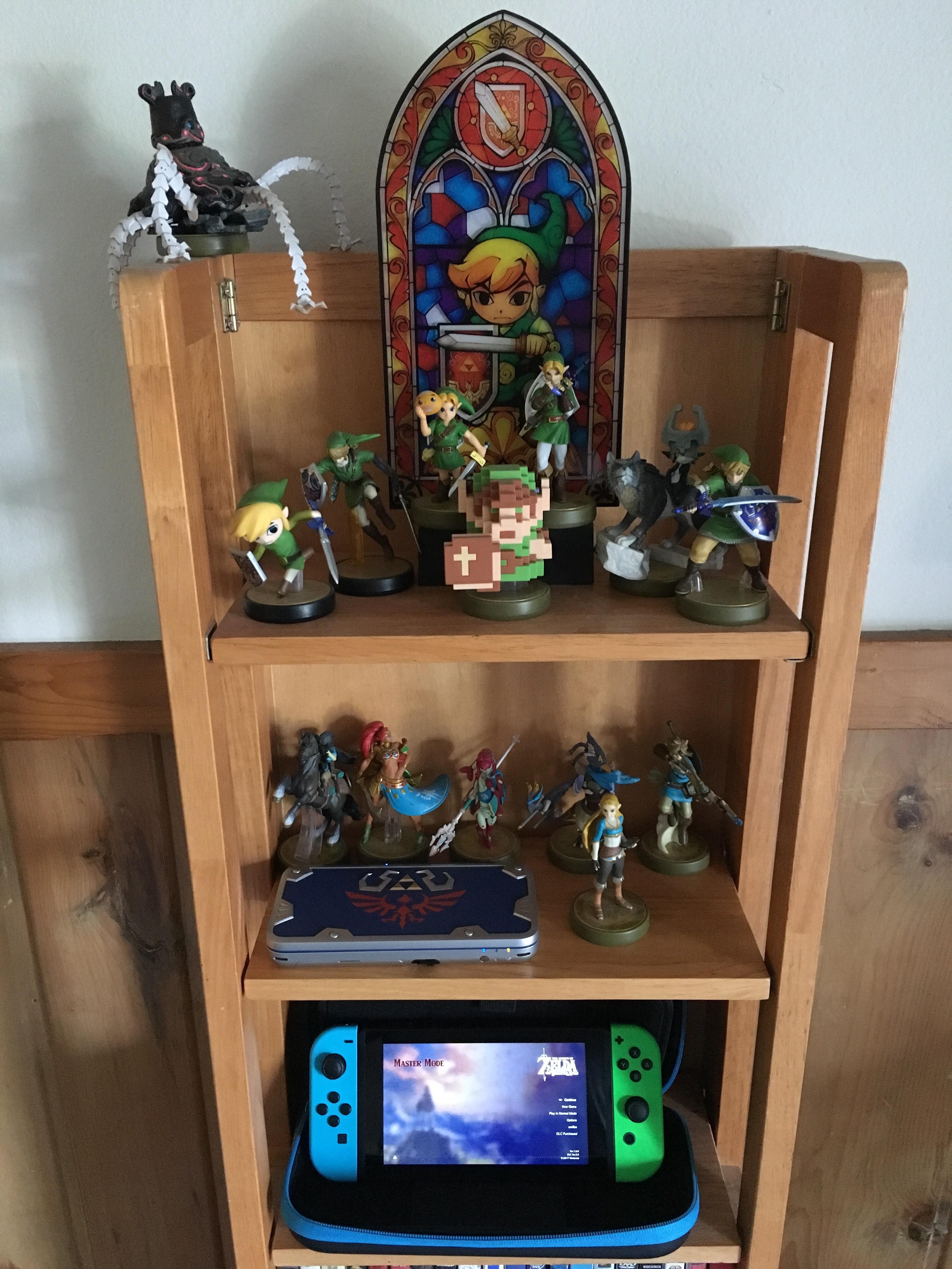 I posted my Zelda shelf about a year ago, this is it now. r/zelda