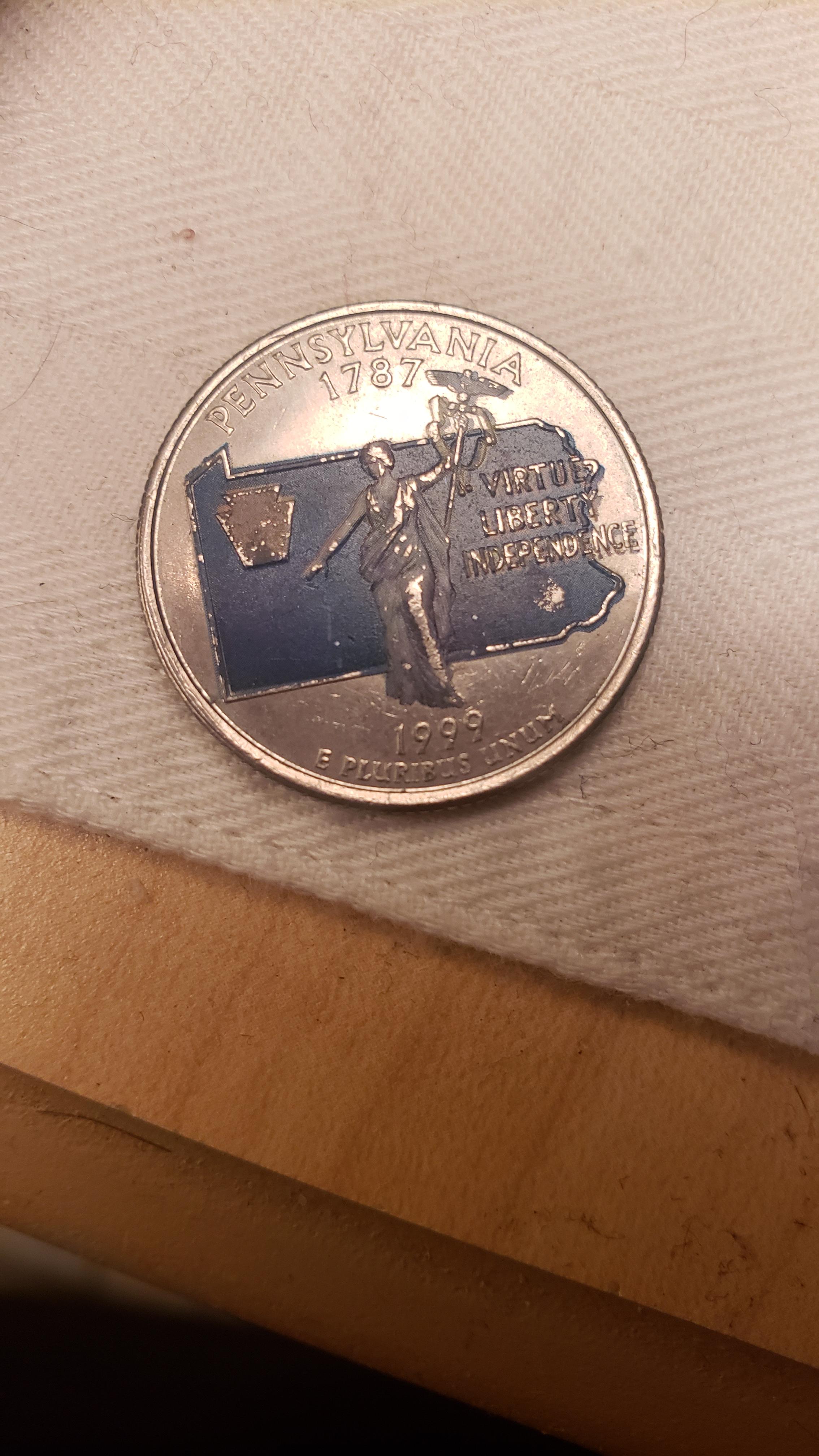 Can someone tell me the story behind this blue quarter? I've never seen