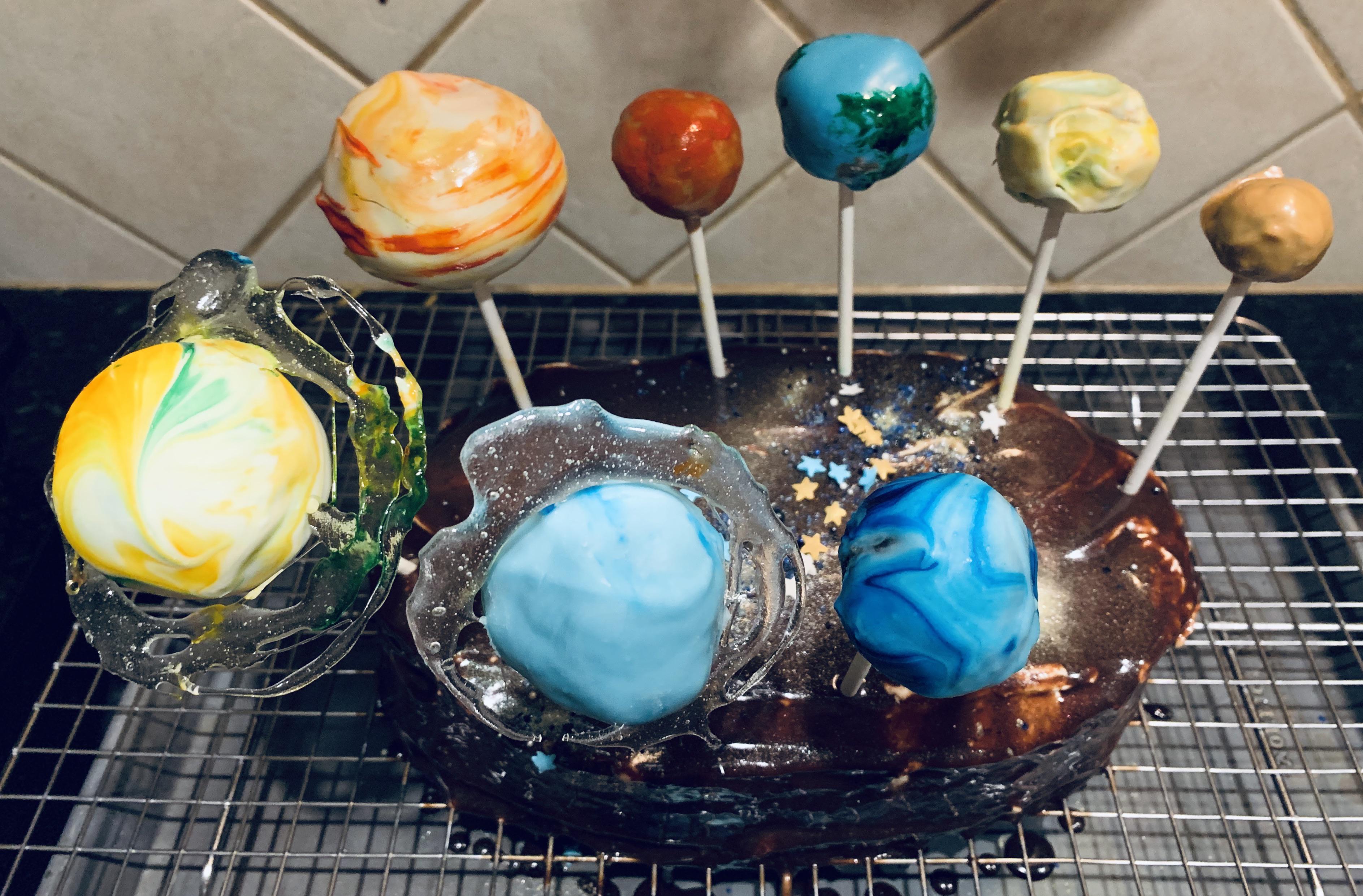 Solar system cake with mirror glaze and cake pops. Baking