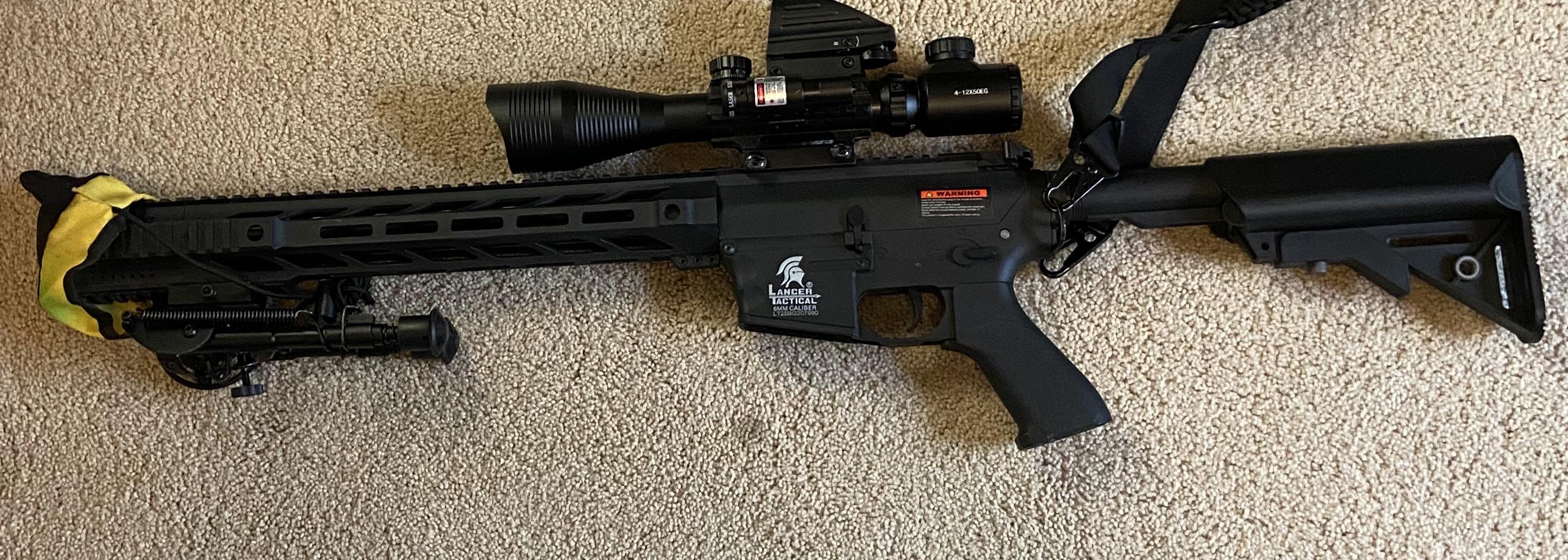 A Very Nice Assault Rifle, With Two Scopes, A Laser, and Extendable