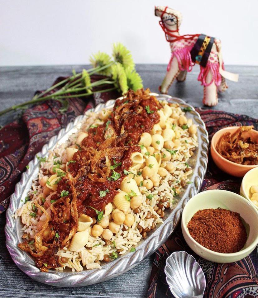 Vegan Egyptian Koshary—the national dish of Egypt—consisting of rice, lentils, chickpeas, and