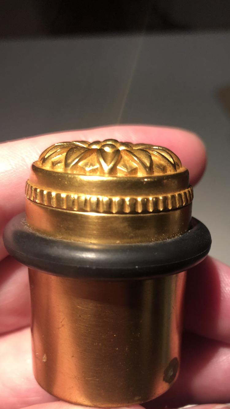 Is this ridiculous or what, we were gifted a gold door stop made with