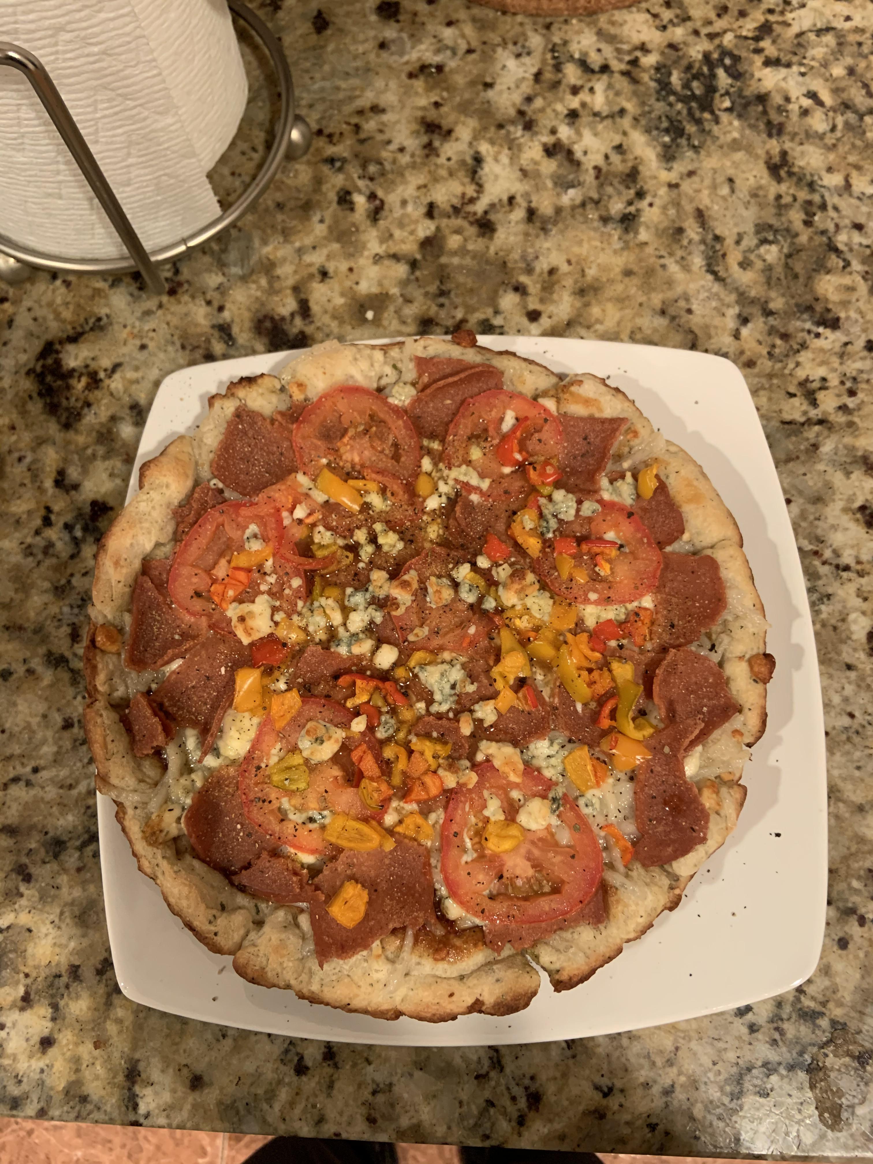 Made my first pizza. Store bought Focaccia dough, spicy BBQ sauce