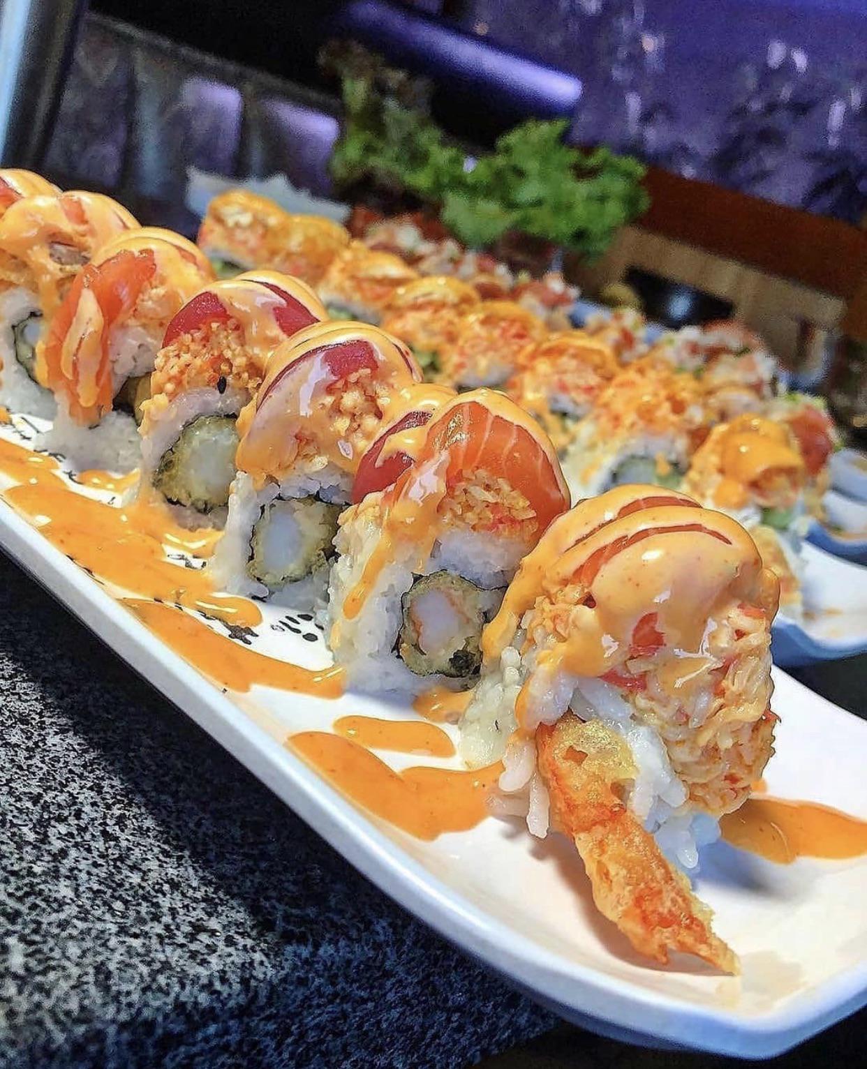 Cowboy roll Shrimp tempura, spicy crab, tuna & salmon drizzled in our