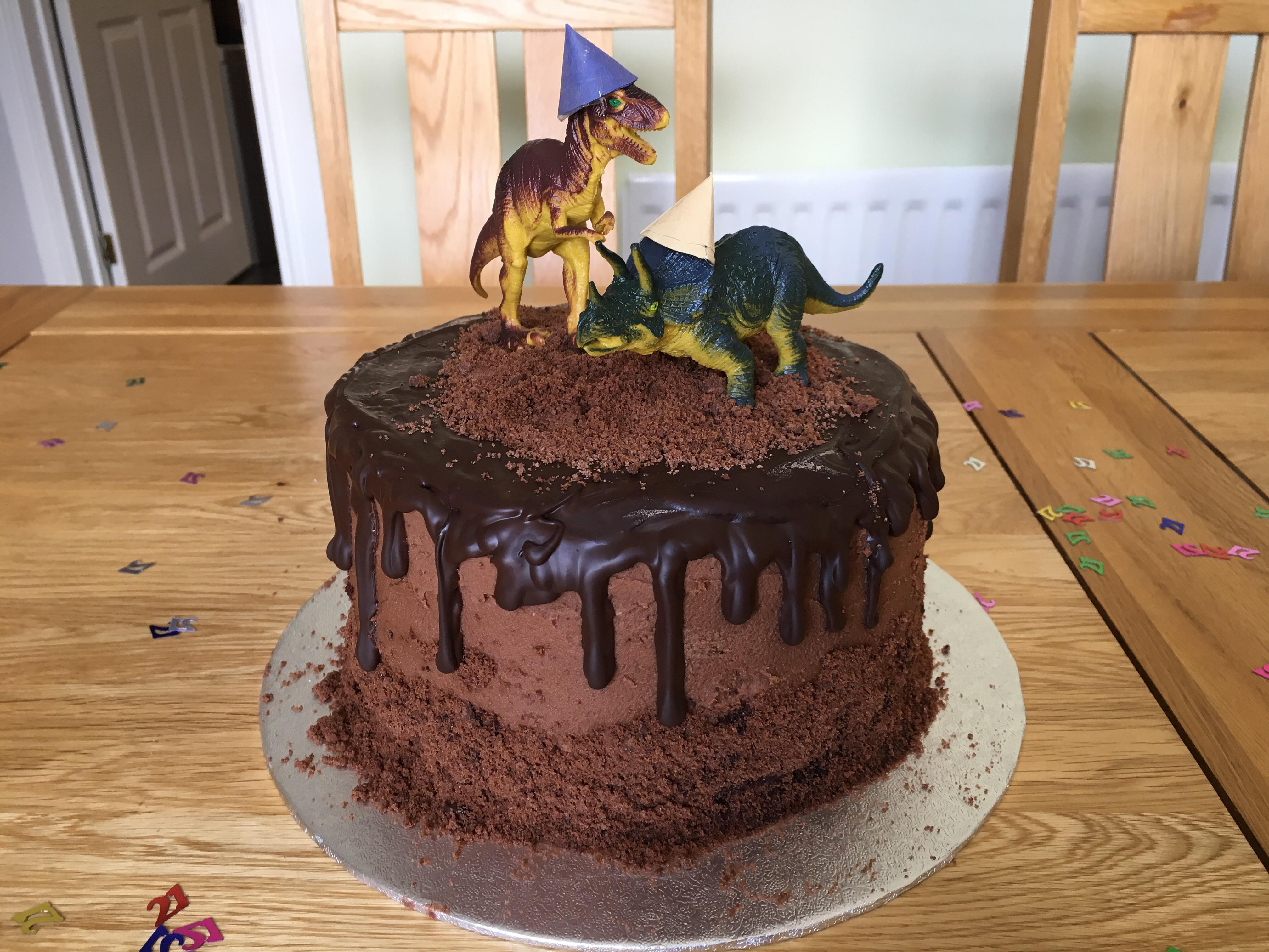 Homemade dinosaur birthday cake for my 21 year old boyfriend! 4 tier
