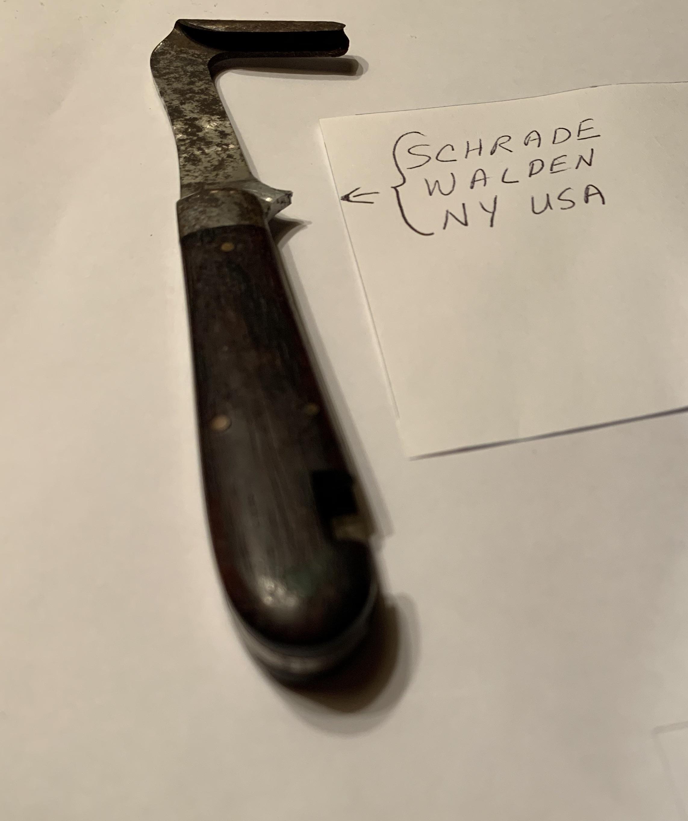 Palm sized pocket knife with strange U shaped blade. U shape is sharp