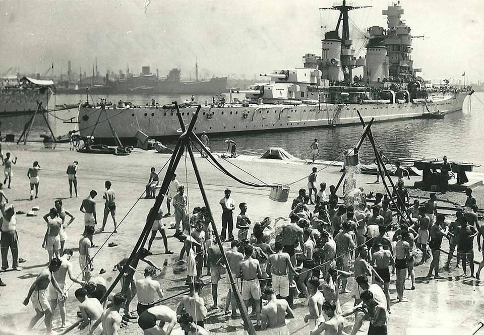 Italian seamen taking a group shower in port, heavy cruiser Gorizia