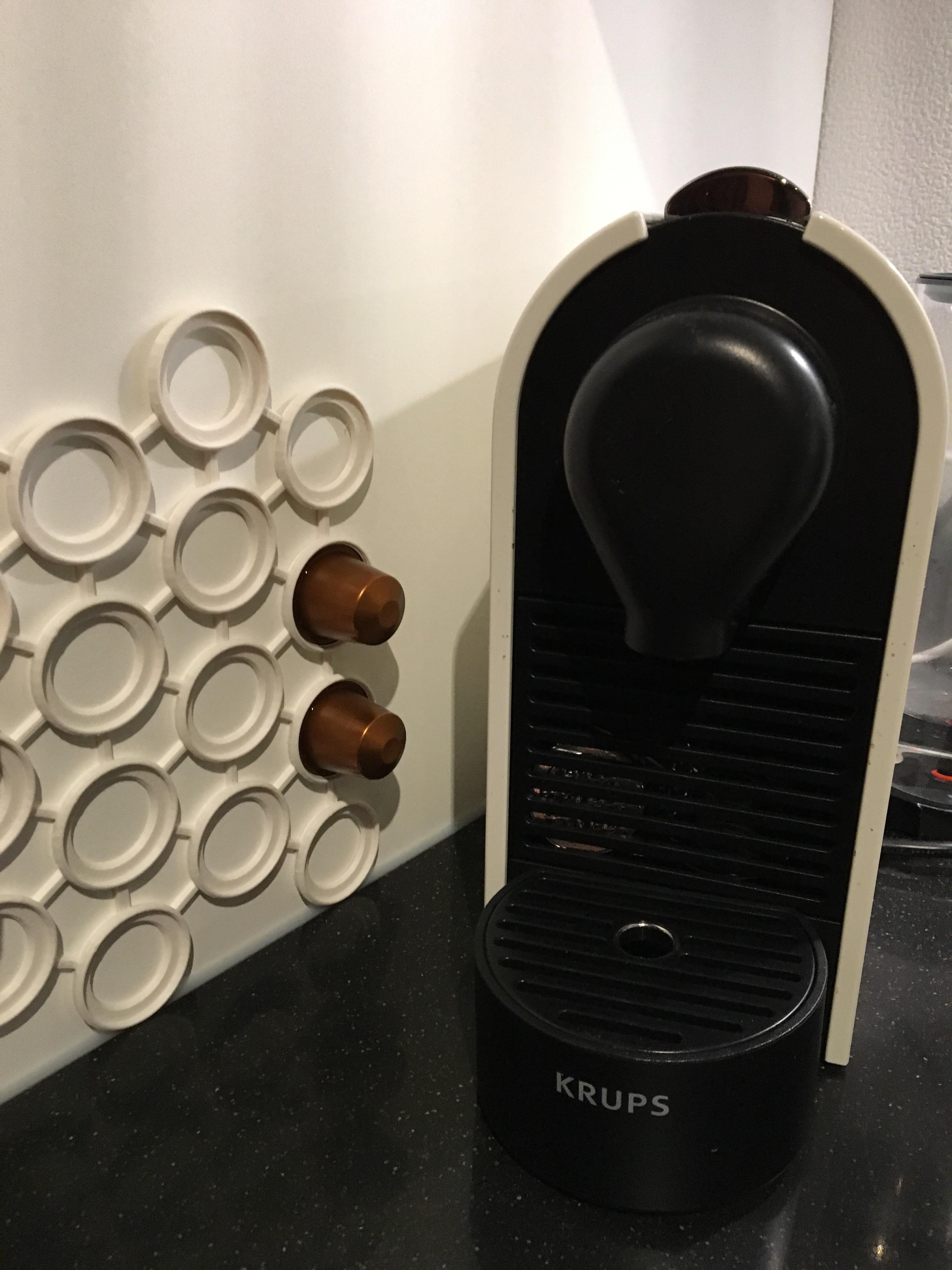 Modeled and printed a holder for Nespresso cups, they snap in and out