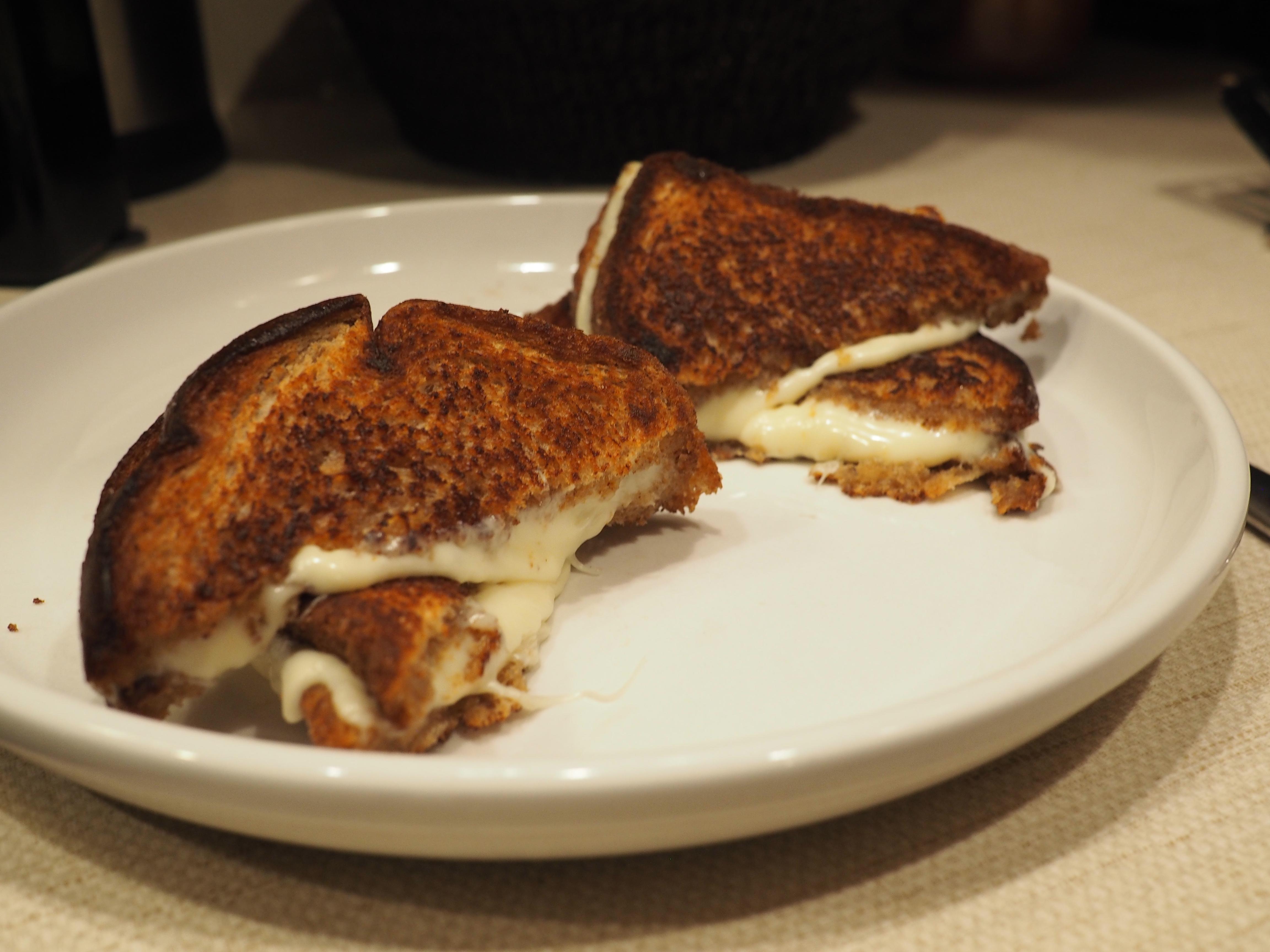 Wheat bread toasted in butter inside and out, and Wegmans Deluxe American cheese. Because I am a