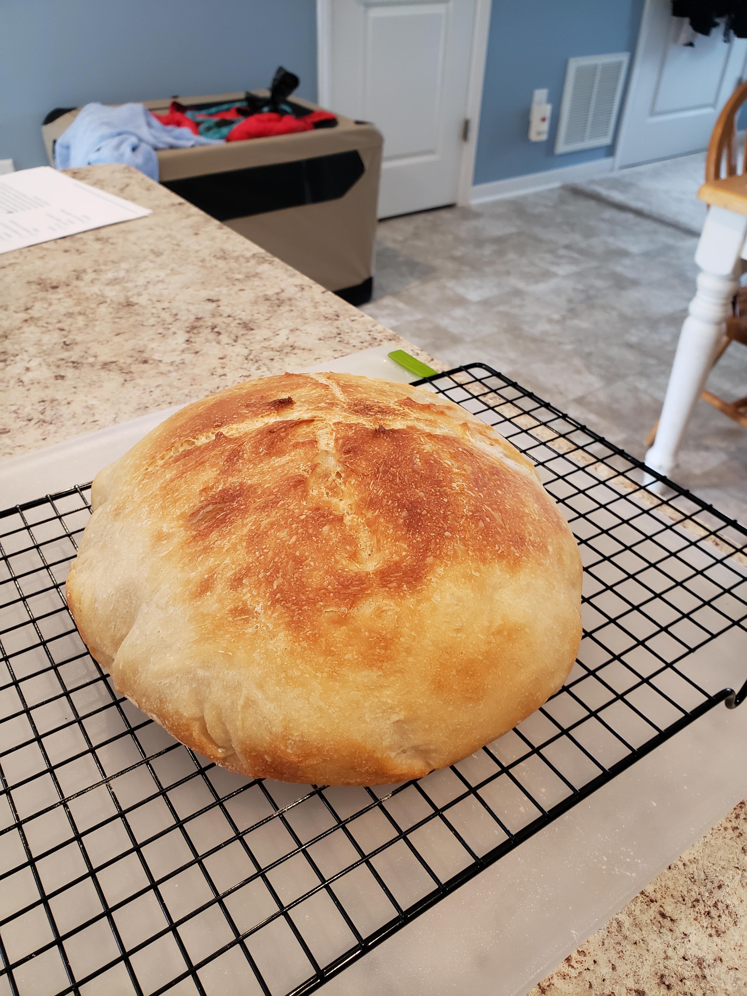 Used my machine's dough setting for the first time, and then baked this awesome boule in my