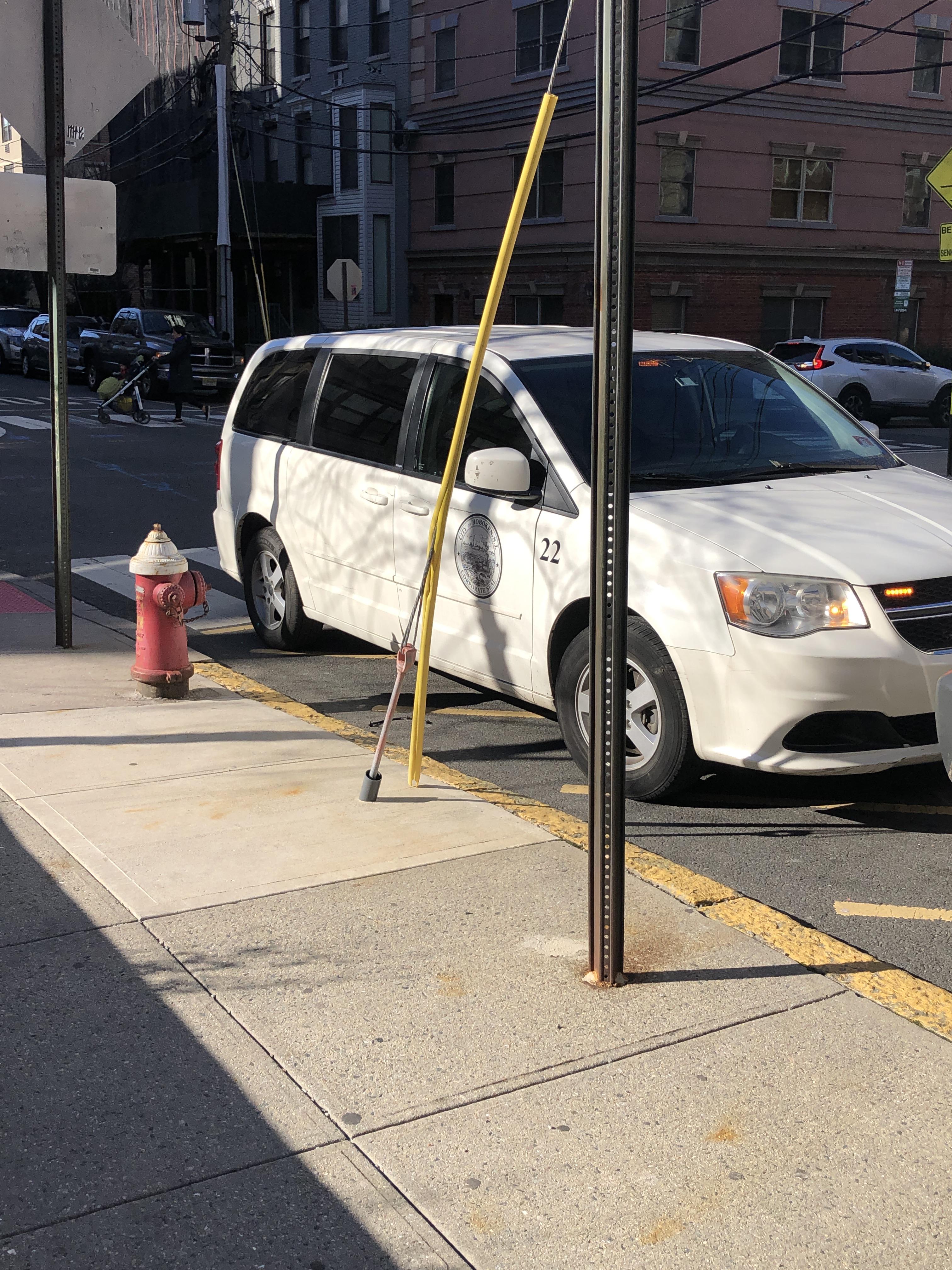 Running vehicle with no driver, blocking a fire hydrant and in front of