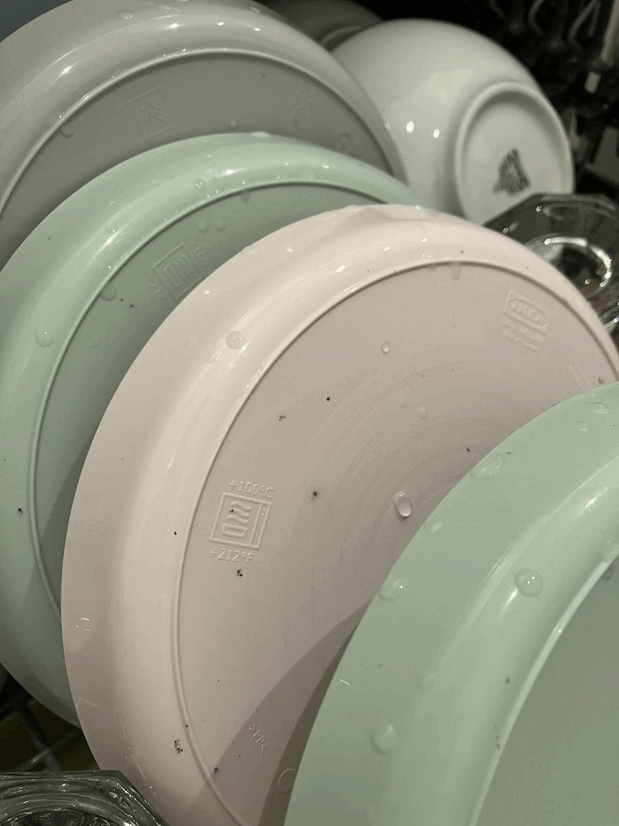 Black spots appearing on plastic items from the dishwasher. Does anyone