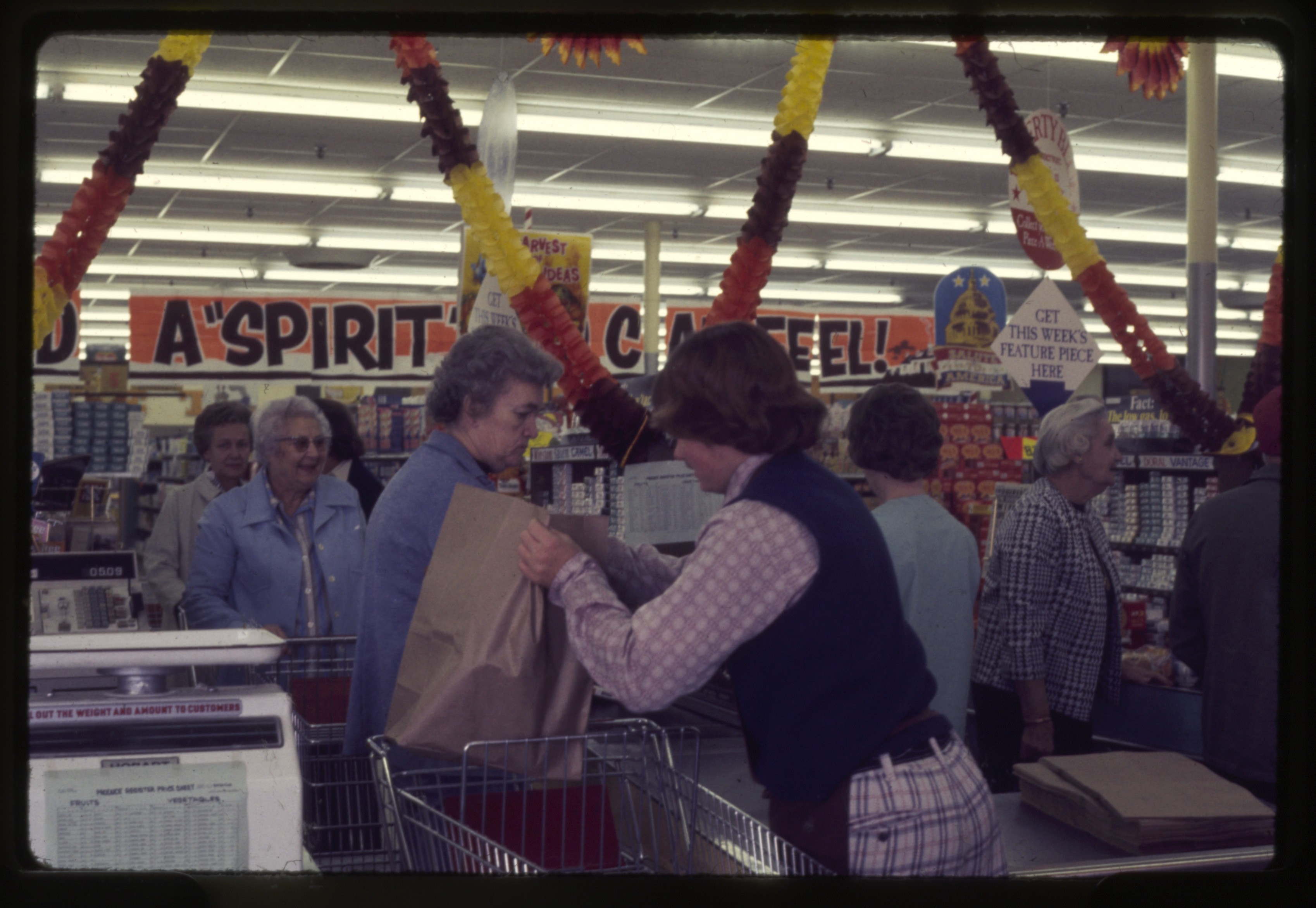 Customers checking out at a grocery store in Wilson County, NC (circa