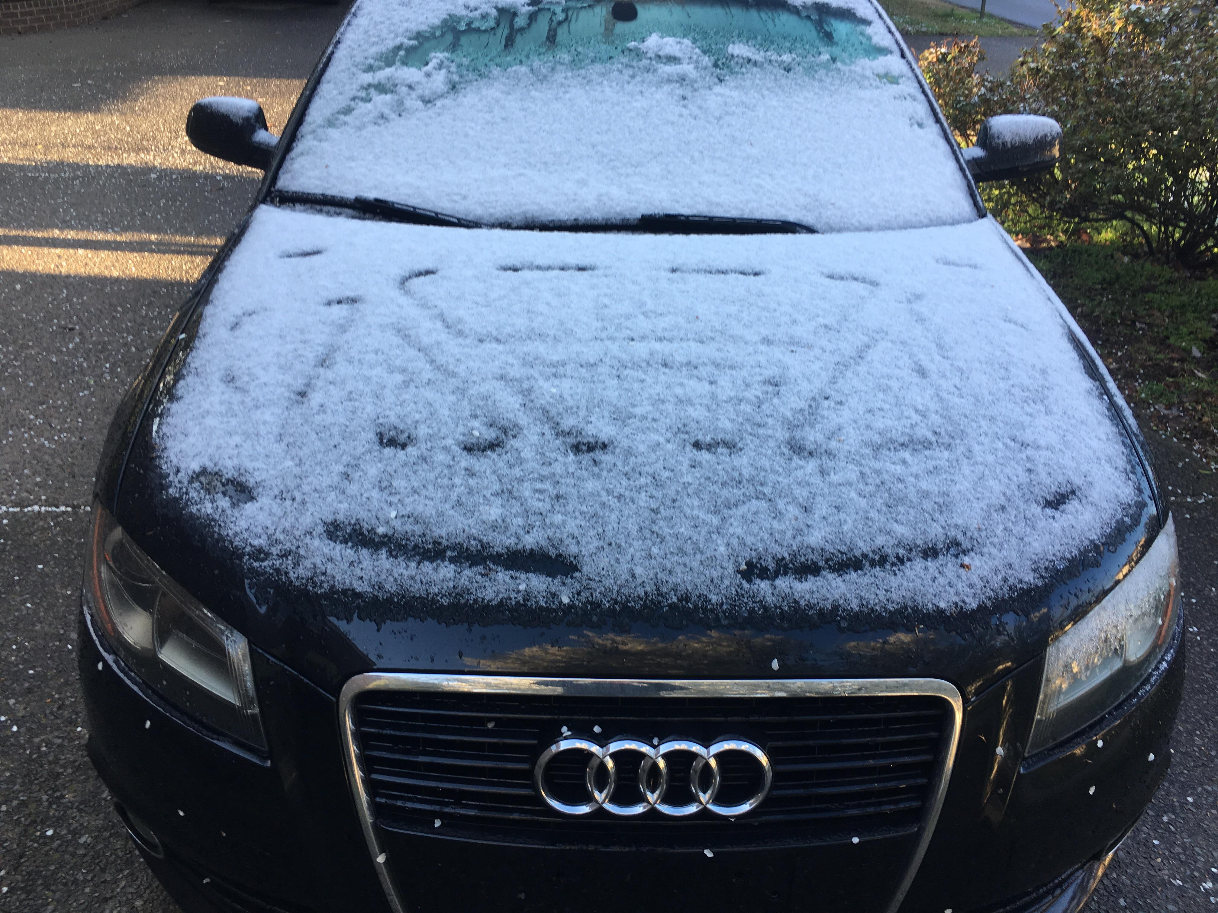 This snow on my car melted into the shape of the engine r