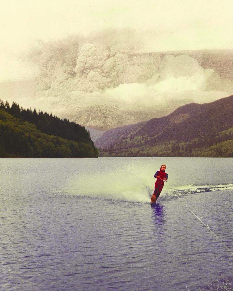 19 year old Jim Hobson water skiing with an erupting Mount St. Helens