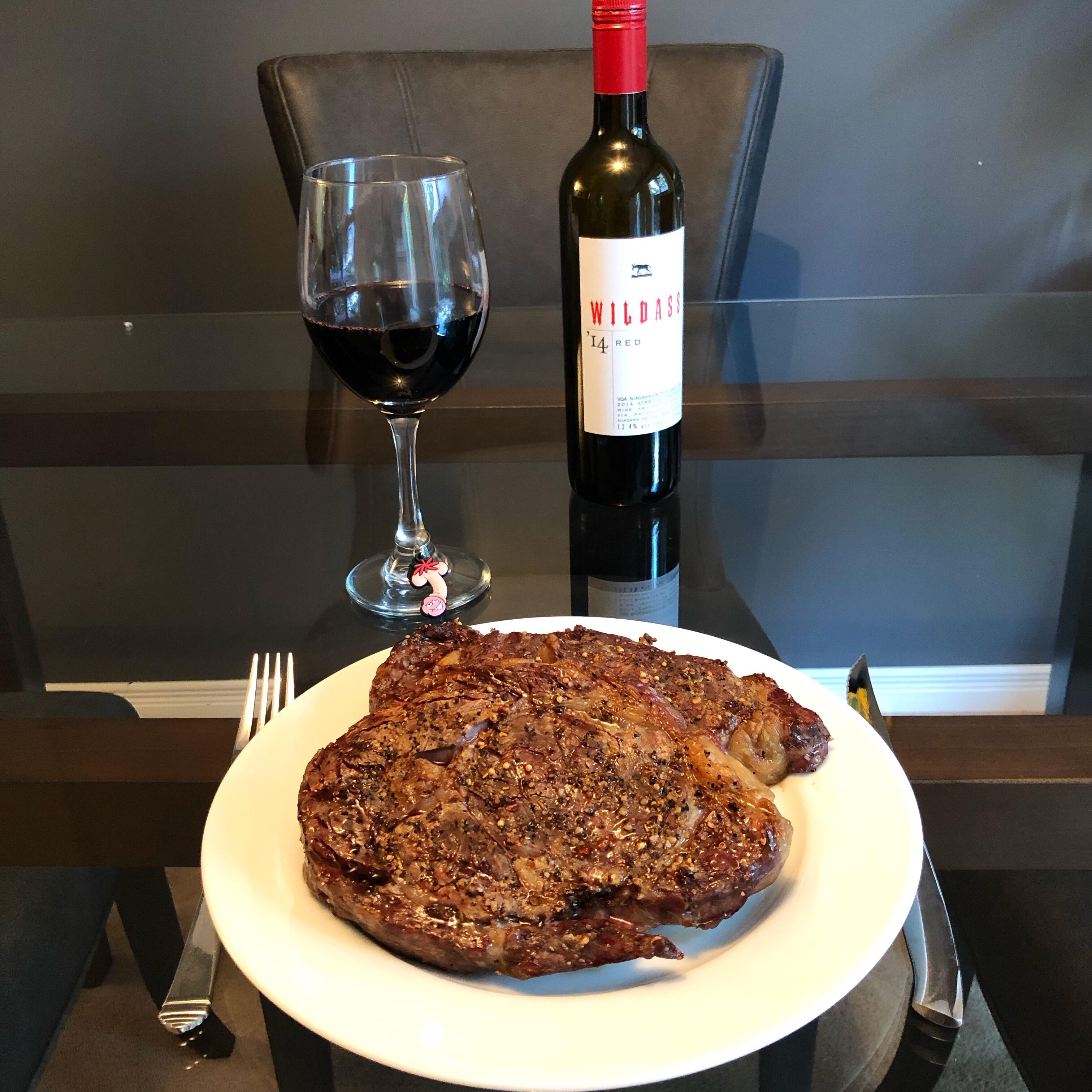 Dinner! Ribeye steaks and a bottle of wine. r/BBQ