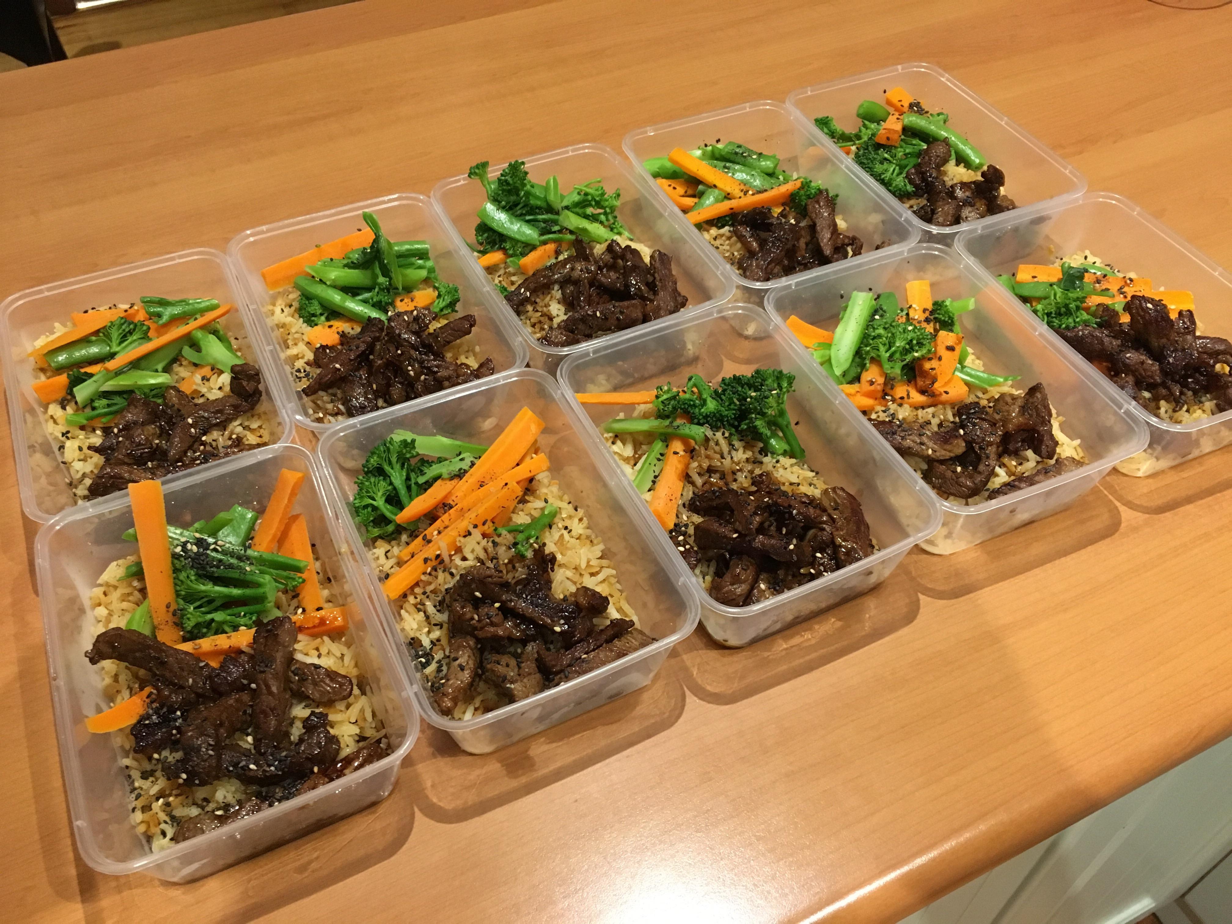 Broccoli, Sugar Snap Peas, Carrots and strips of Porterhouse on a bed