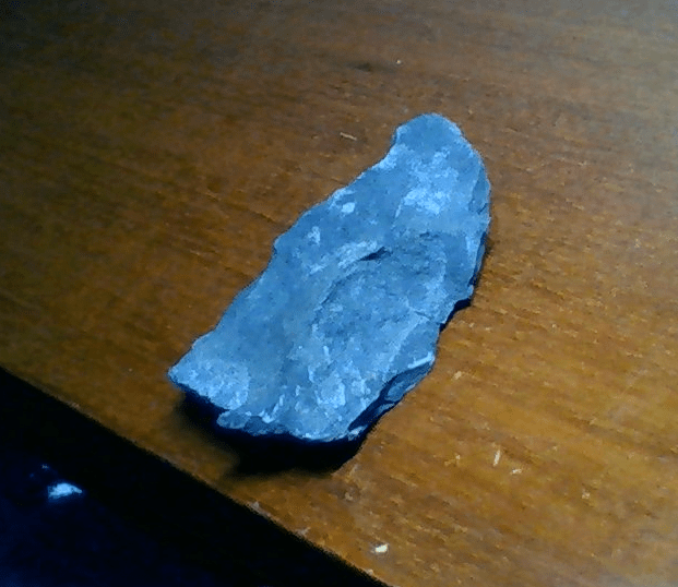 What's this? Dark grey, (very) weakly scratched by copper