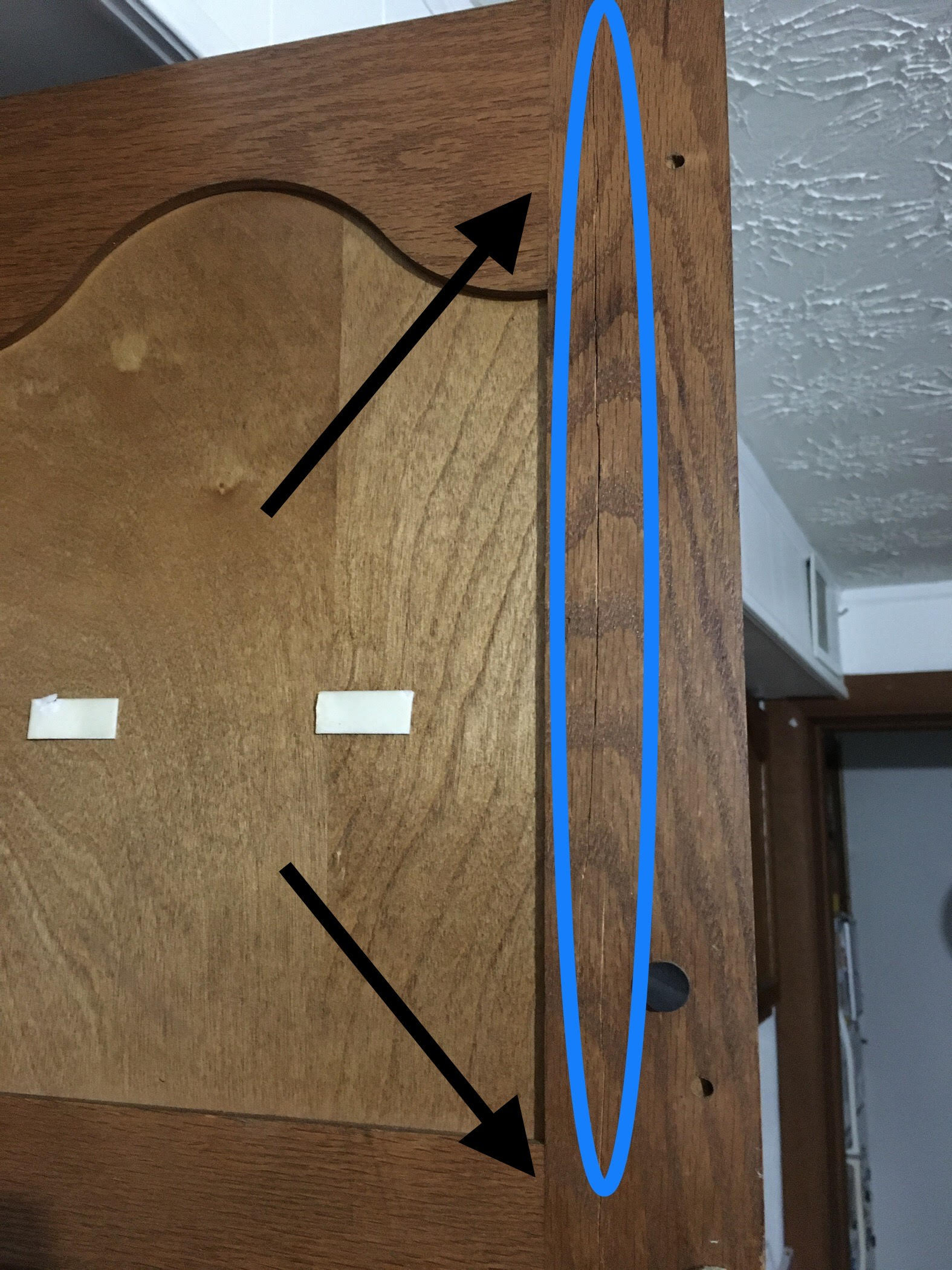 How can I fix this cracked door? The crack is circled in blue