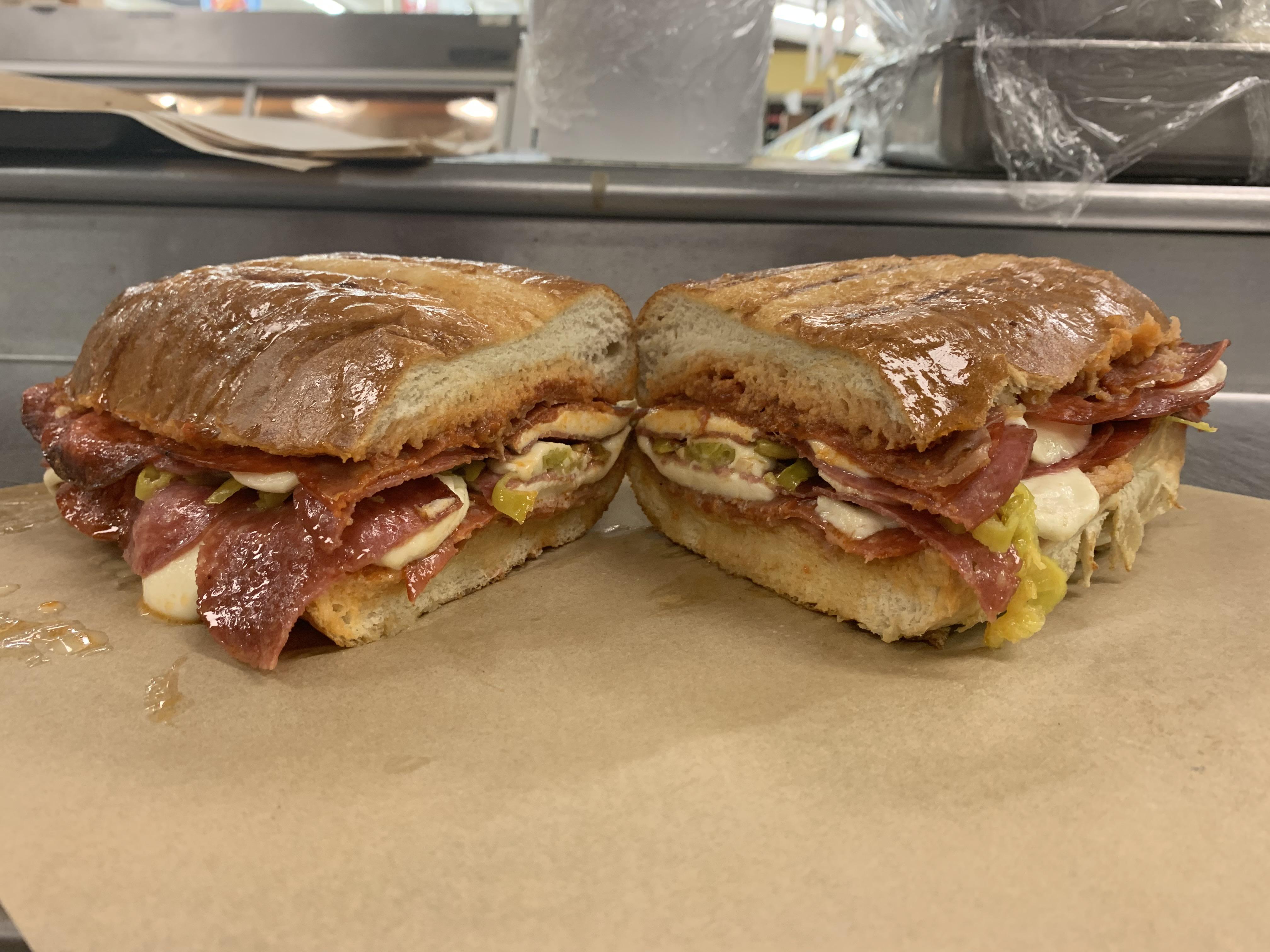 Behold, The Beast! Pepperoni, prosciutto, salami, with red sauce, diced