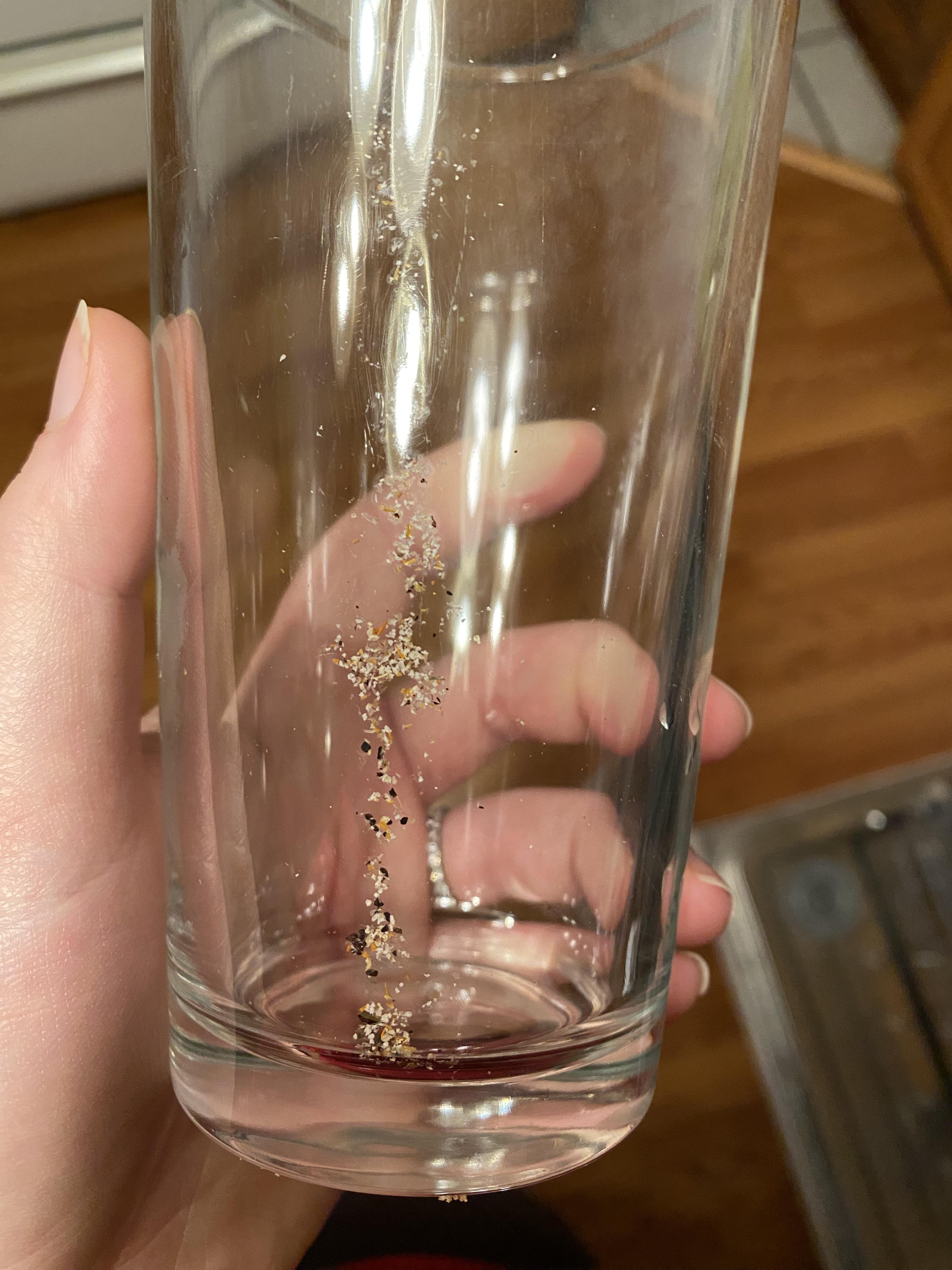 What makes a glass come out of the dishwasher looking like this? r