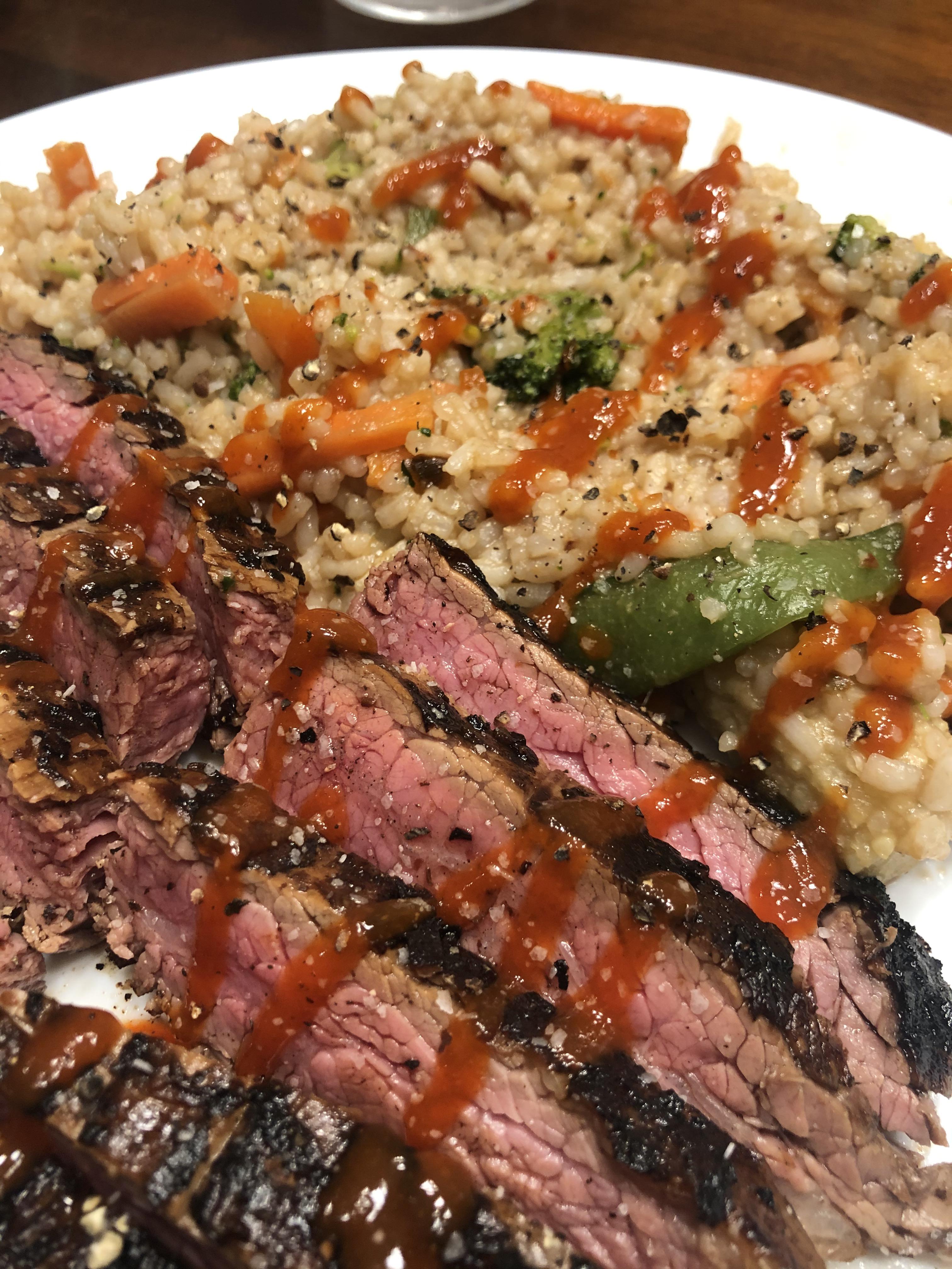 [Homemade] Marinaded flank steak with fried rice and sriracha. r/food