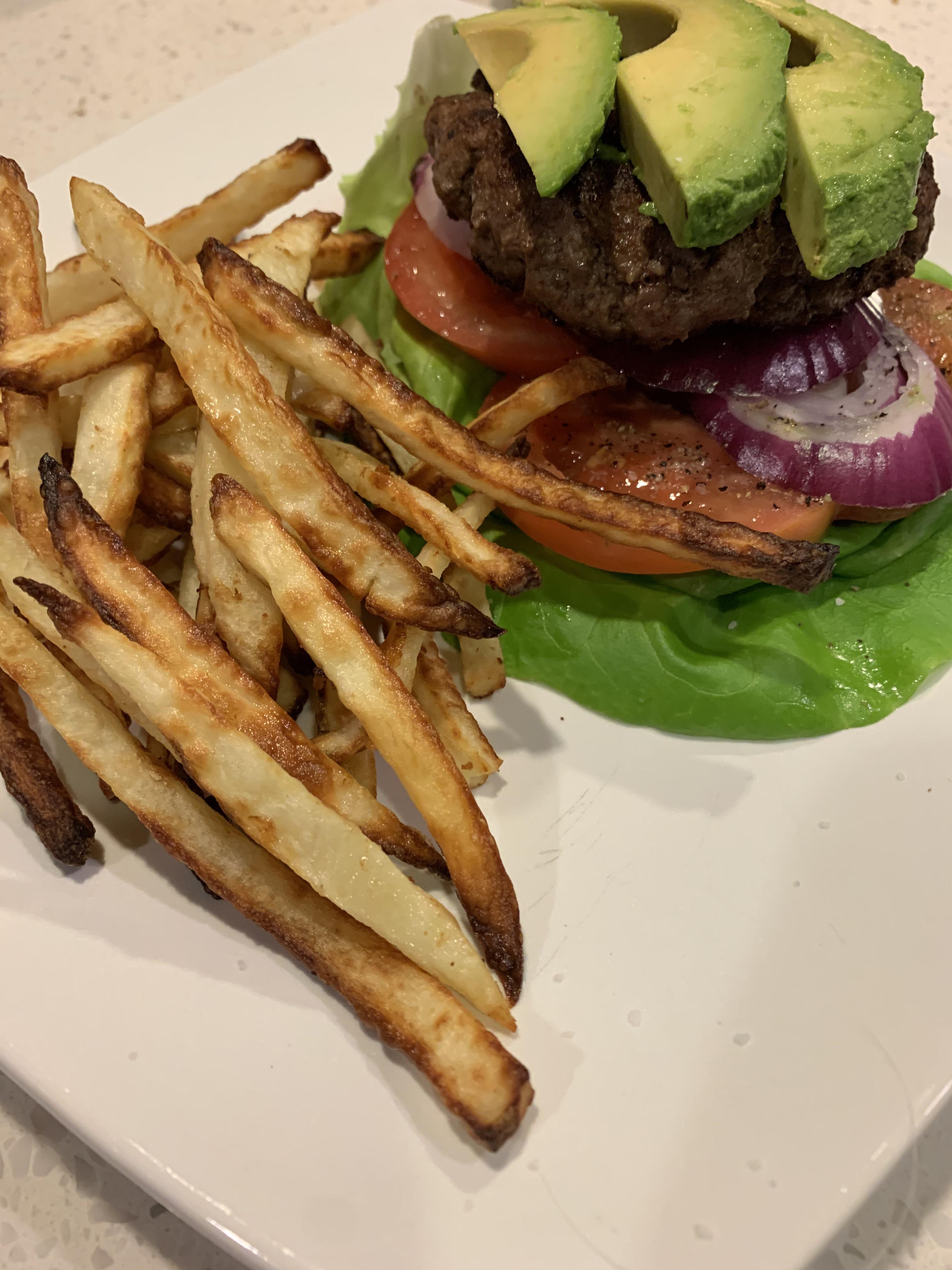 Air fryer fries and lean burger on veggies r/HealthyFood