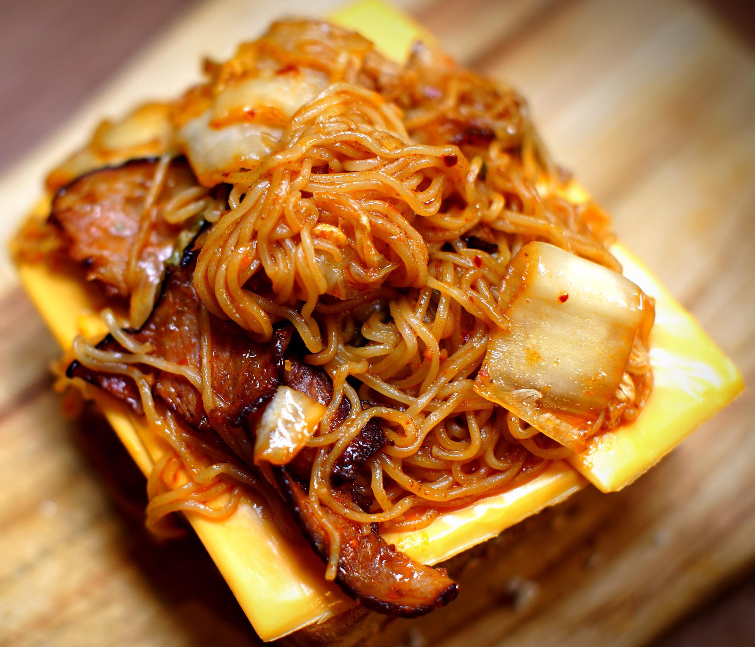 Making a grilled cheese, bacon, egg, kimchi & ramen sandwich. r/ramen