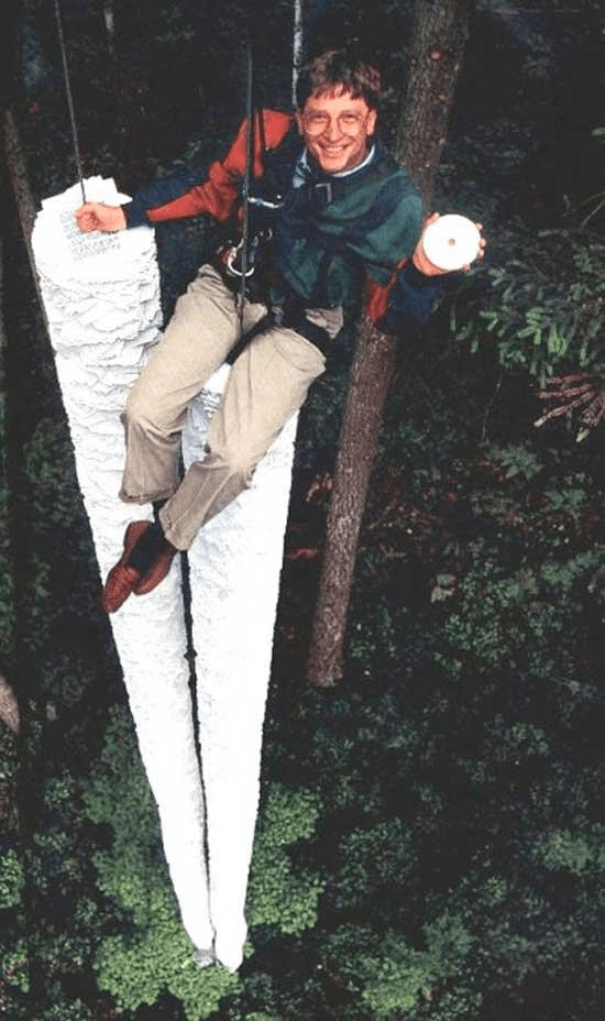 Bill Gates in a campaign pic showing how one CD can hold data equal to