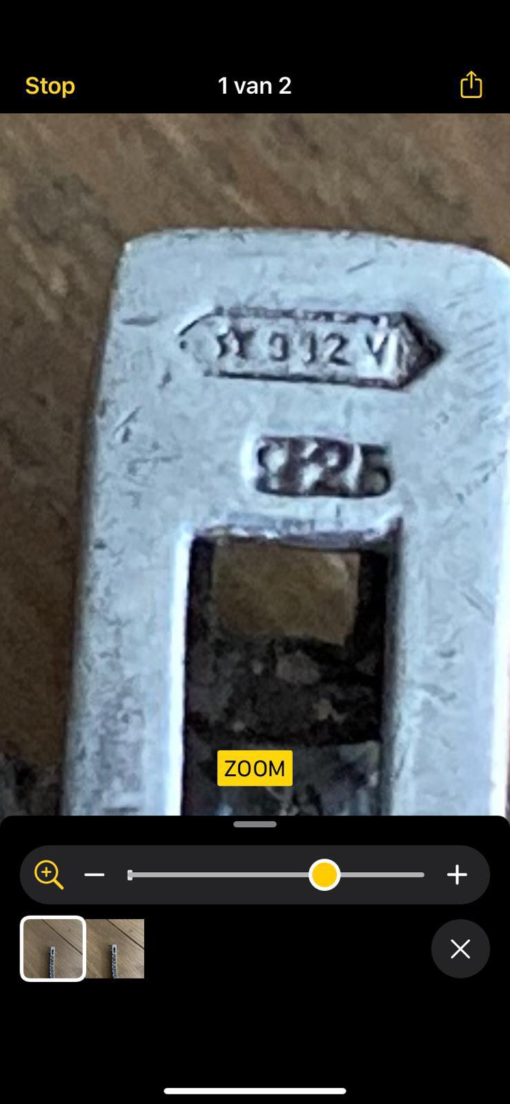 Markings on a really old tennis bracelet anyone have a clue what it