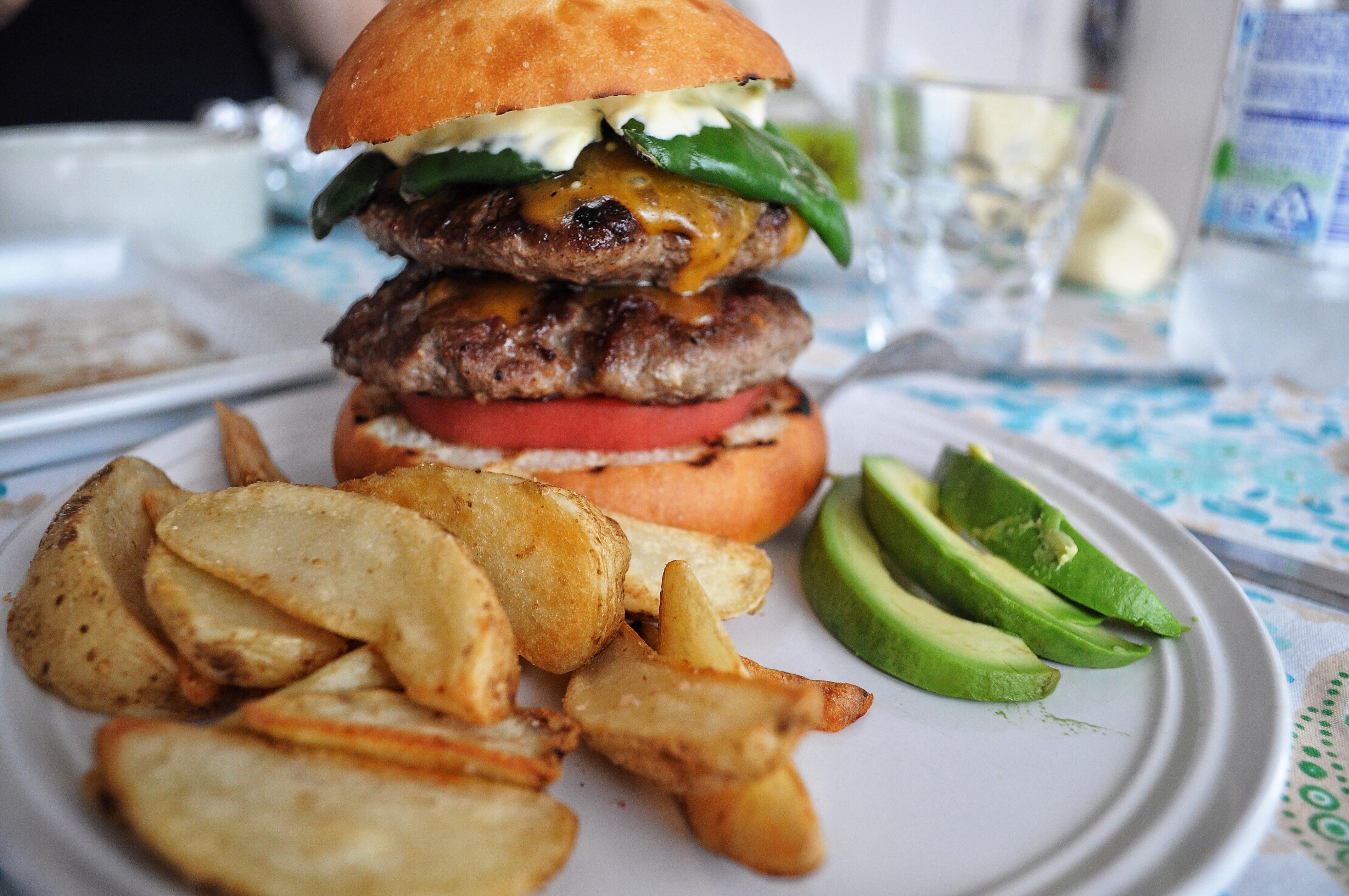 Homemade Cheeseburger with Japanese bell pepper in handmade bun. r