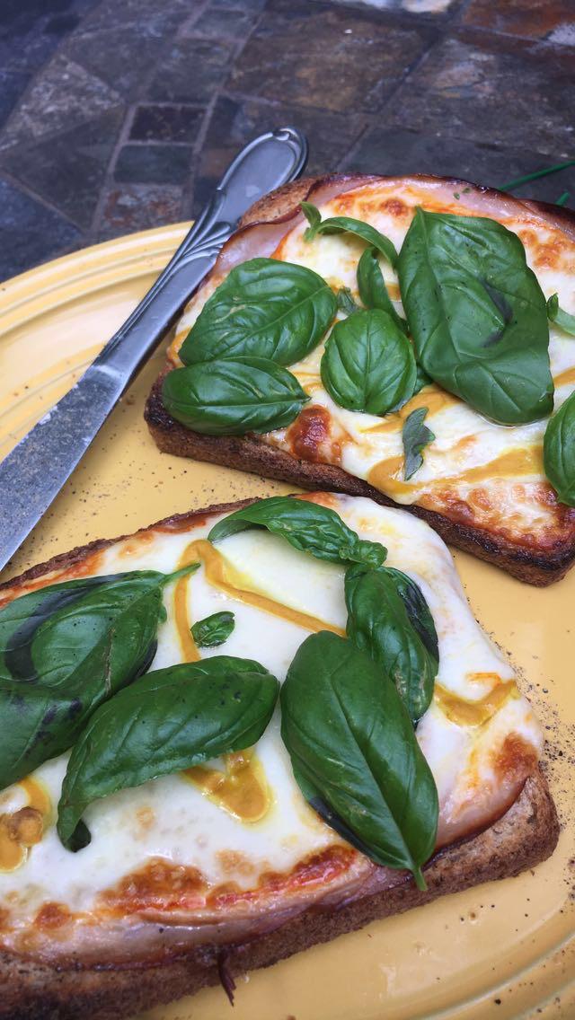 An oldie but a goodie toast with melted Muenster cheese, mustard