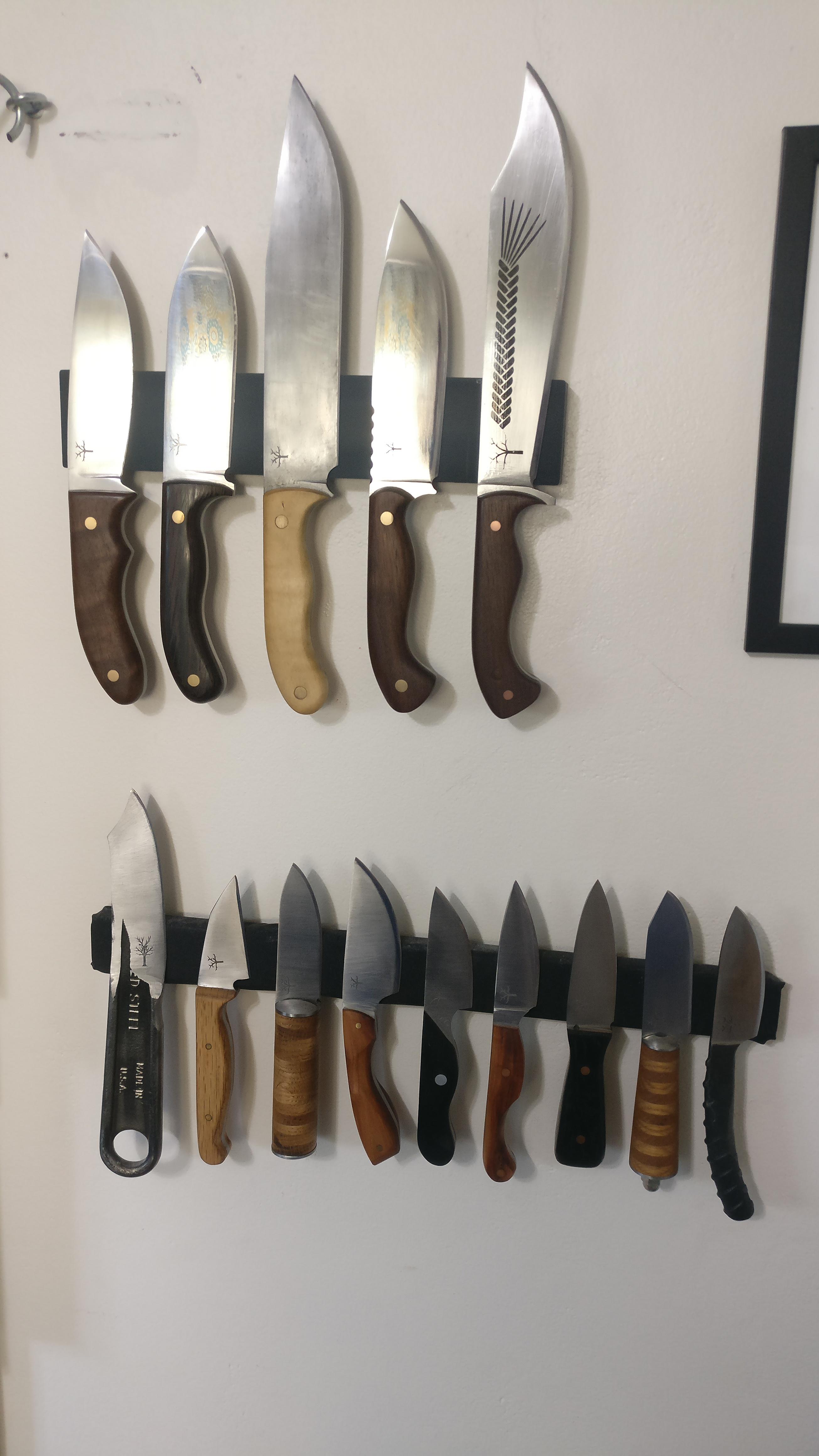 Got some strips up to hold all the knives I've made myself. r